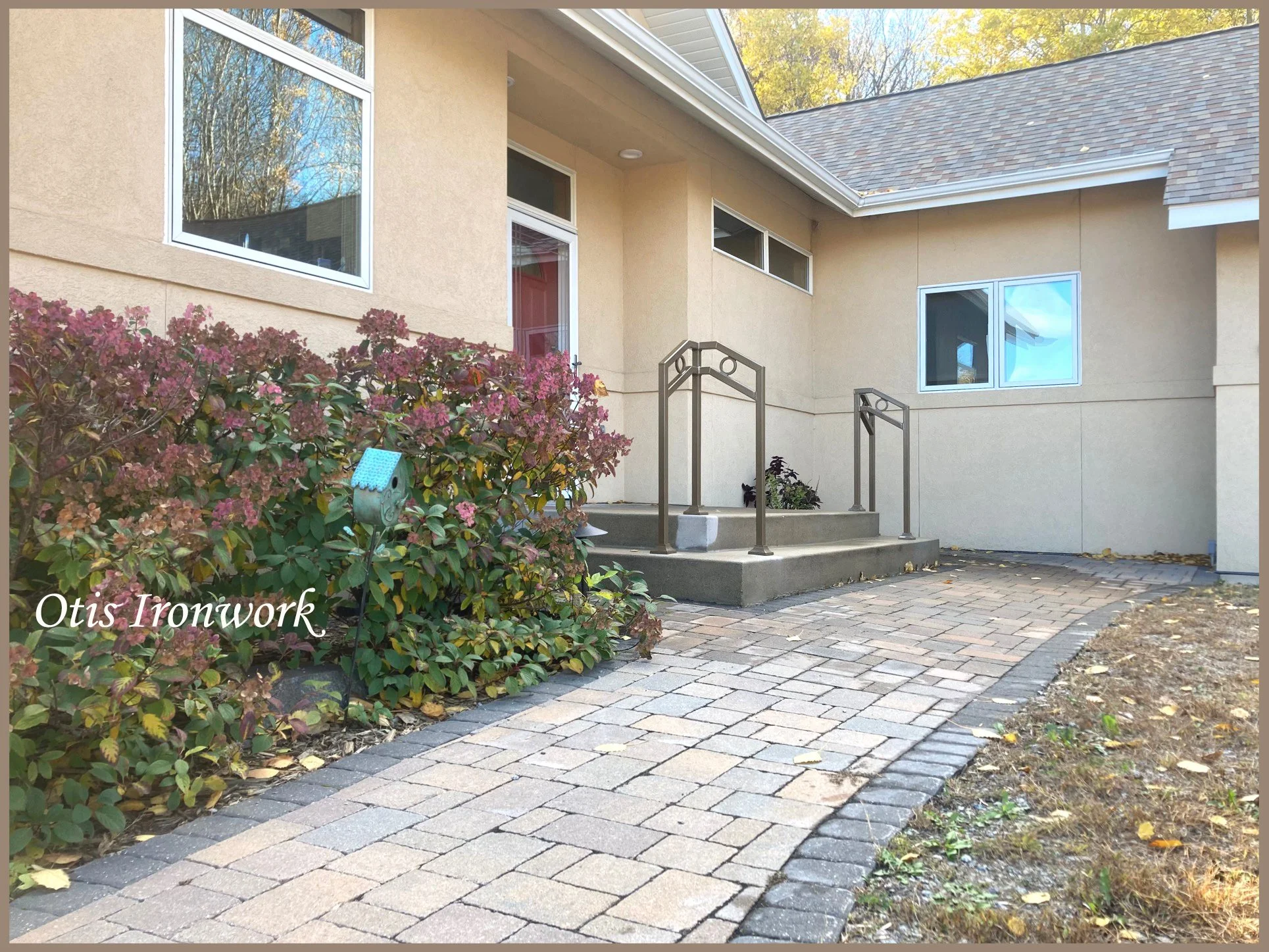 Modern handrails with circle design. Custom railings handcrafted in Minnesota by Otis Ironwork. Welded from quality materials including a durable powder coat paint finish and professional installation. Call Otis Ironwork at 507-995-3745 to get your r