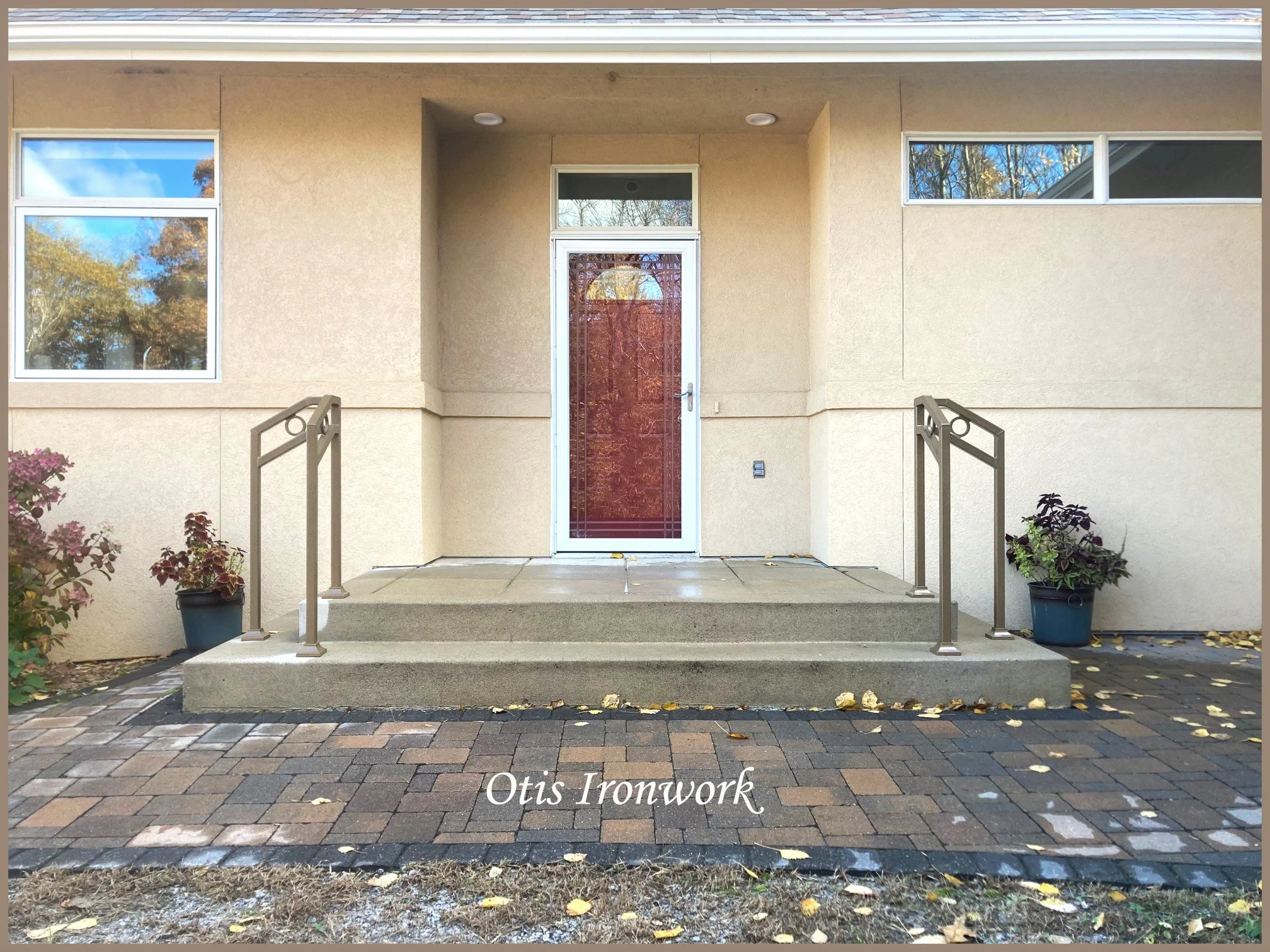 Modern handrails with circle design. Custom railings handcrafted in Minnesota by Otis Ironwork. Welded from quality materials including a durable powder coat paint finish and professional installation. Call Otis Ironwork at 507-995-3745 to get your r