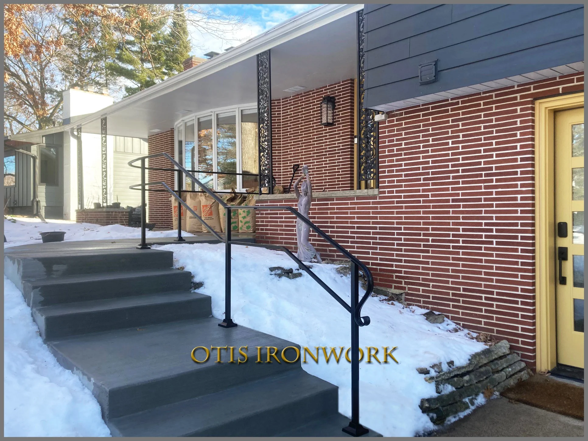 Custom curved handrail handcrafted by Otis Ironwork. Welded from quality materials including a durable powder coat paint finish and professional installation. Call Otis Ironwork at 507-995-3745 to get your railing project started.