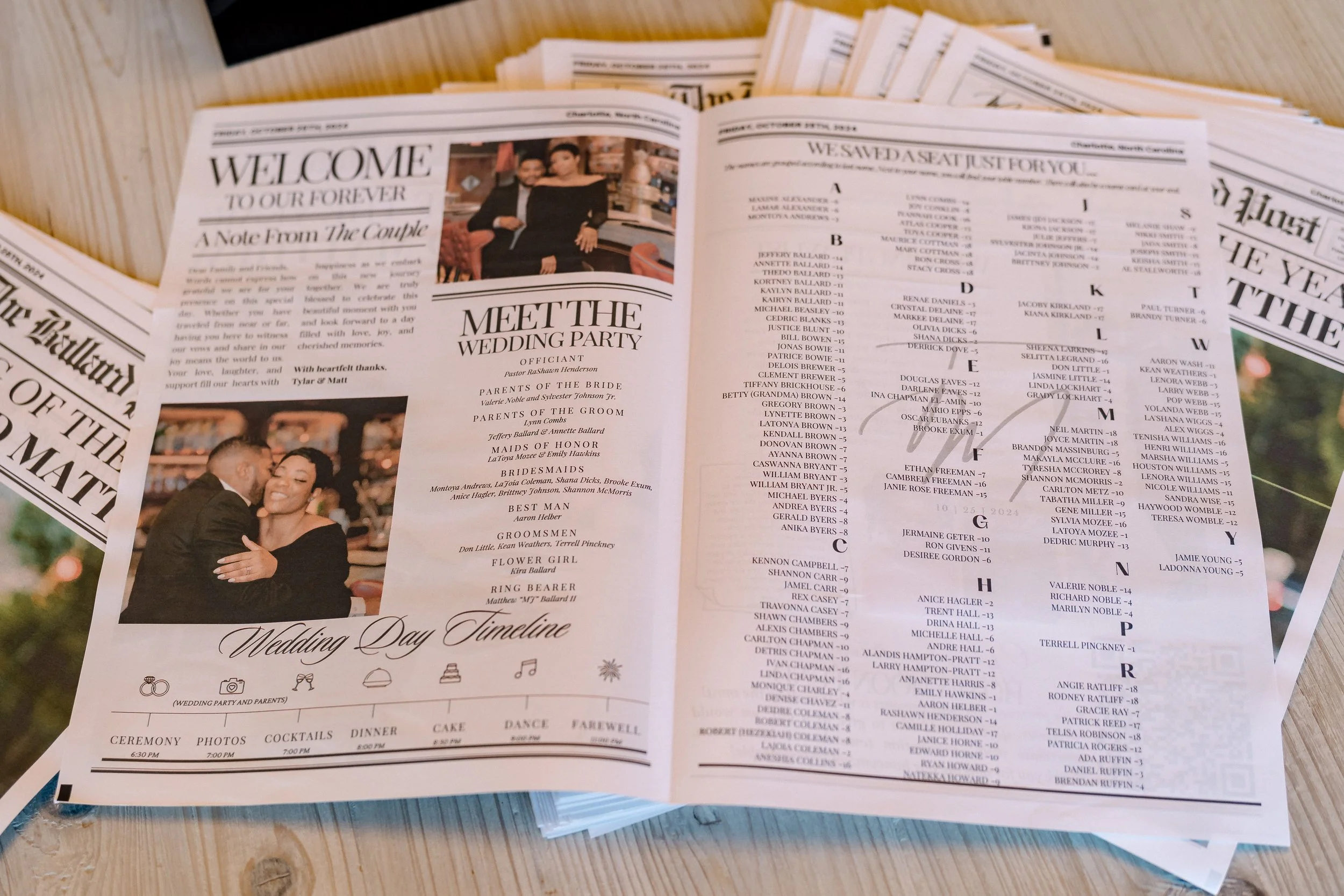 Wedding program brochures spread out on a wooden surface, featuring a bride and groom photo, a seating chart, and wedding details.
