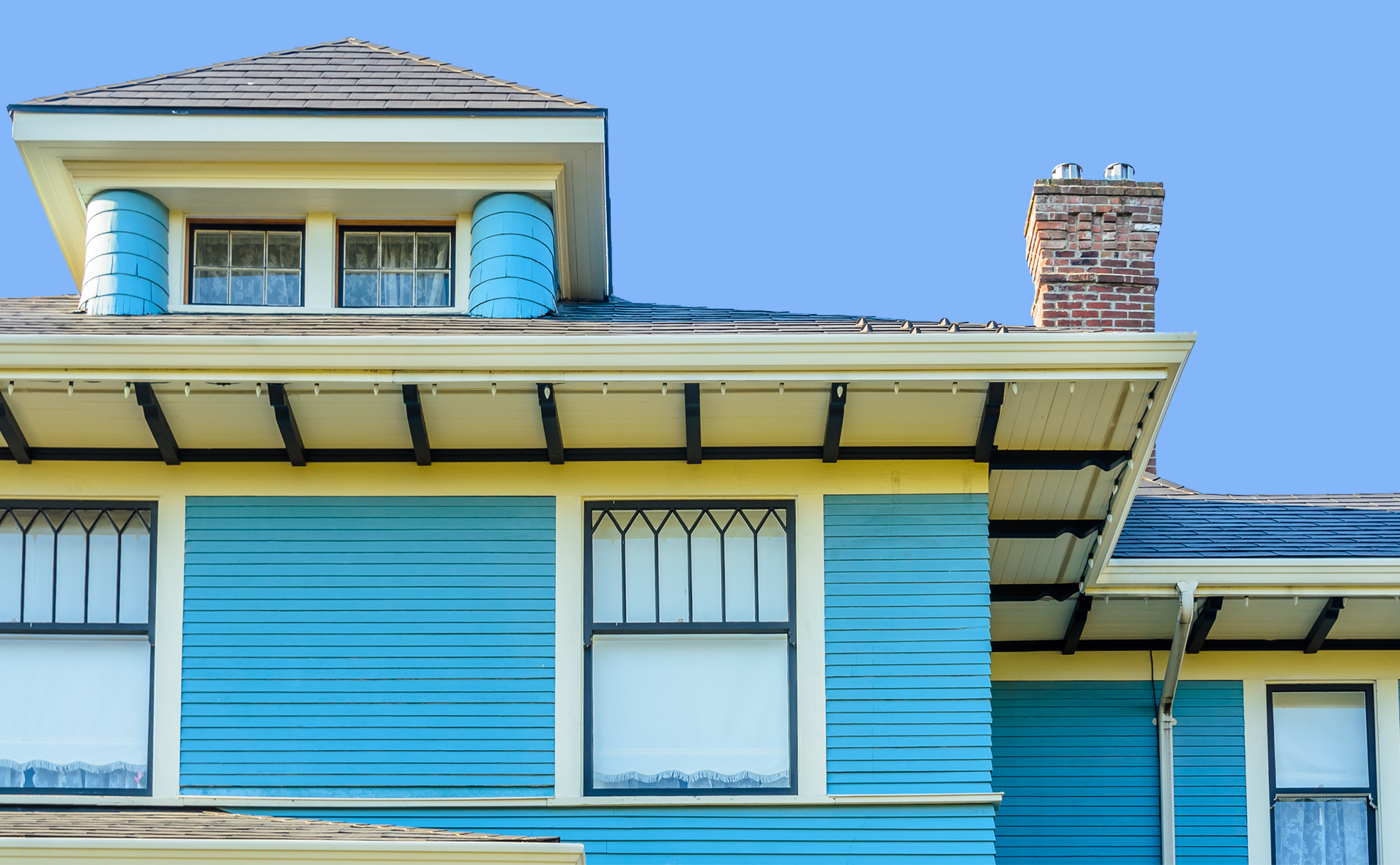 House with blue siding and grey shingles