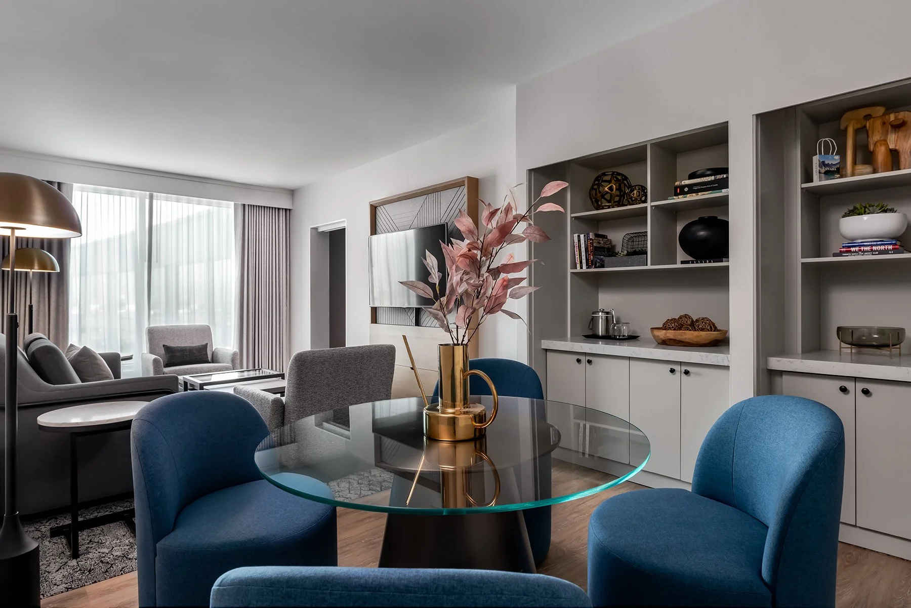 Hotel suite with millwork amenity counters and dining area