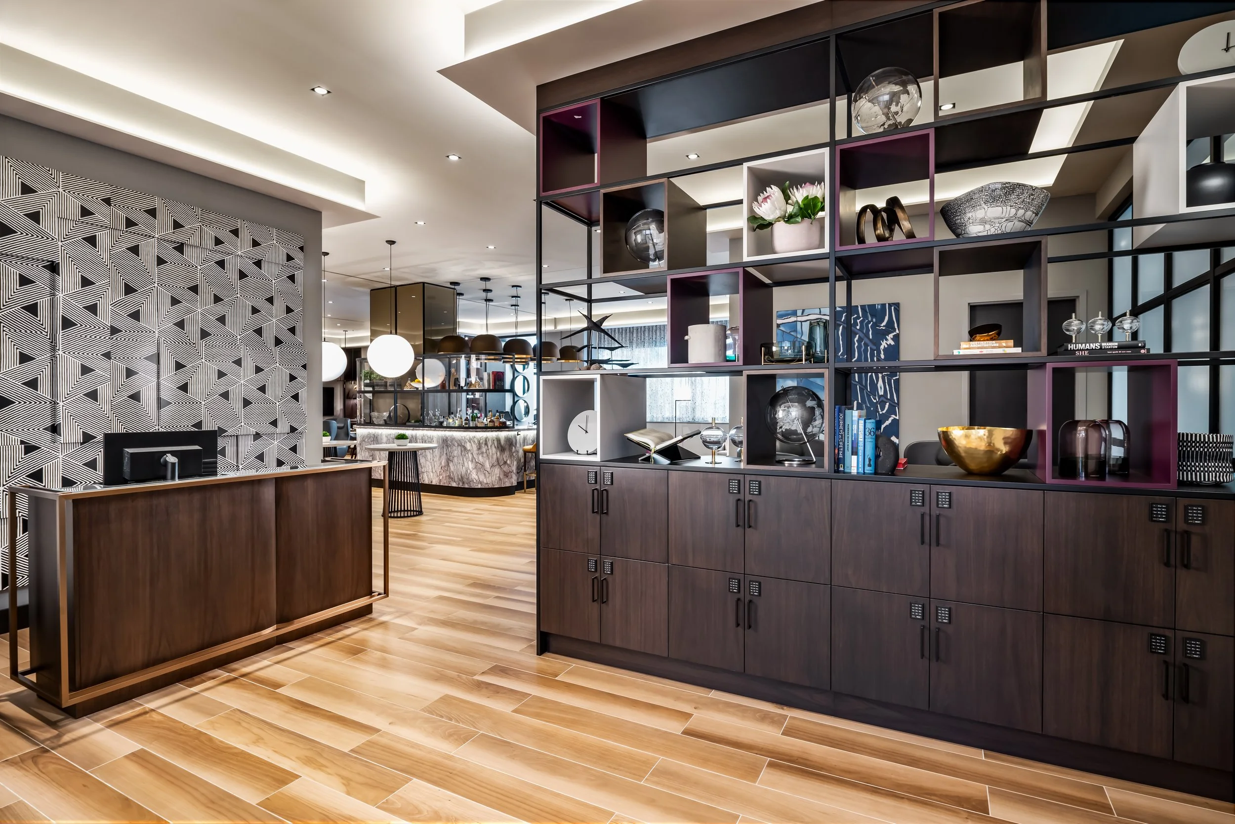 Club lounge entry with wood locker millwork and check-in desk