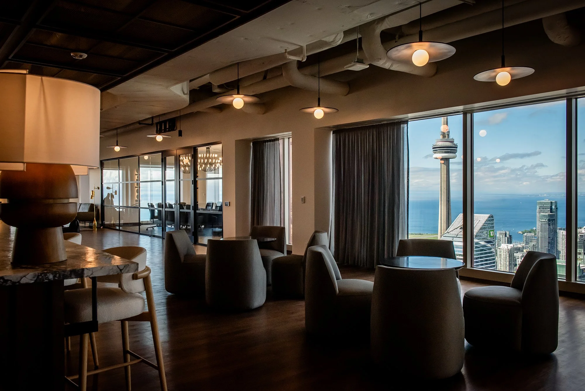 Seating area near window with view to Toronto's CN Tower