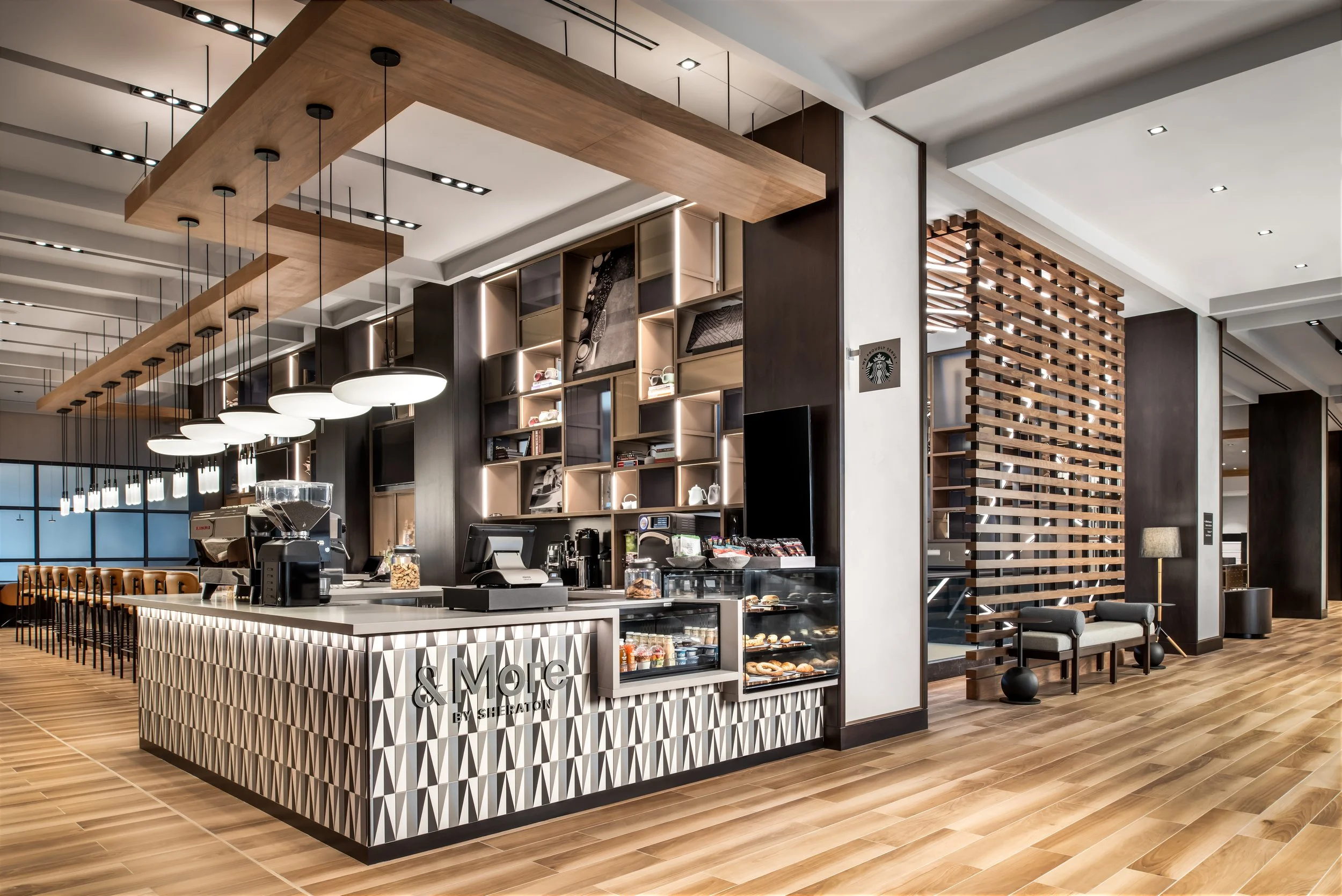 Hotel bar coffee bar with suspended wood ceiling and pendant lighting