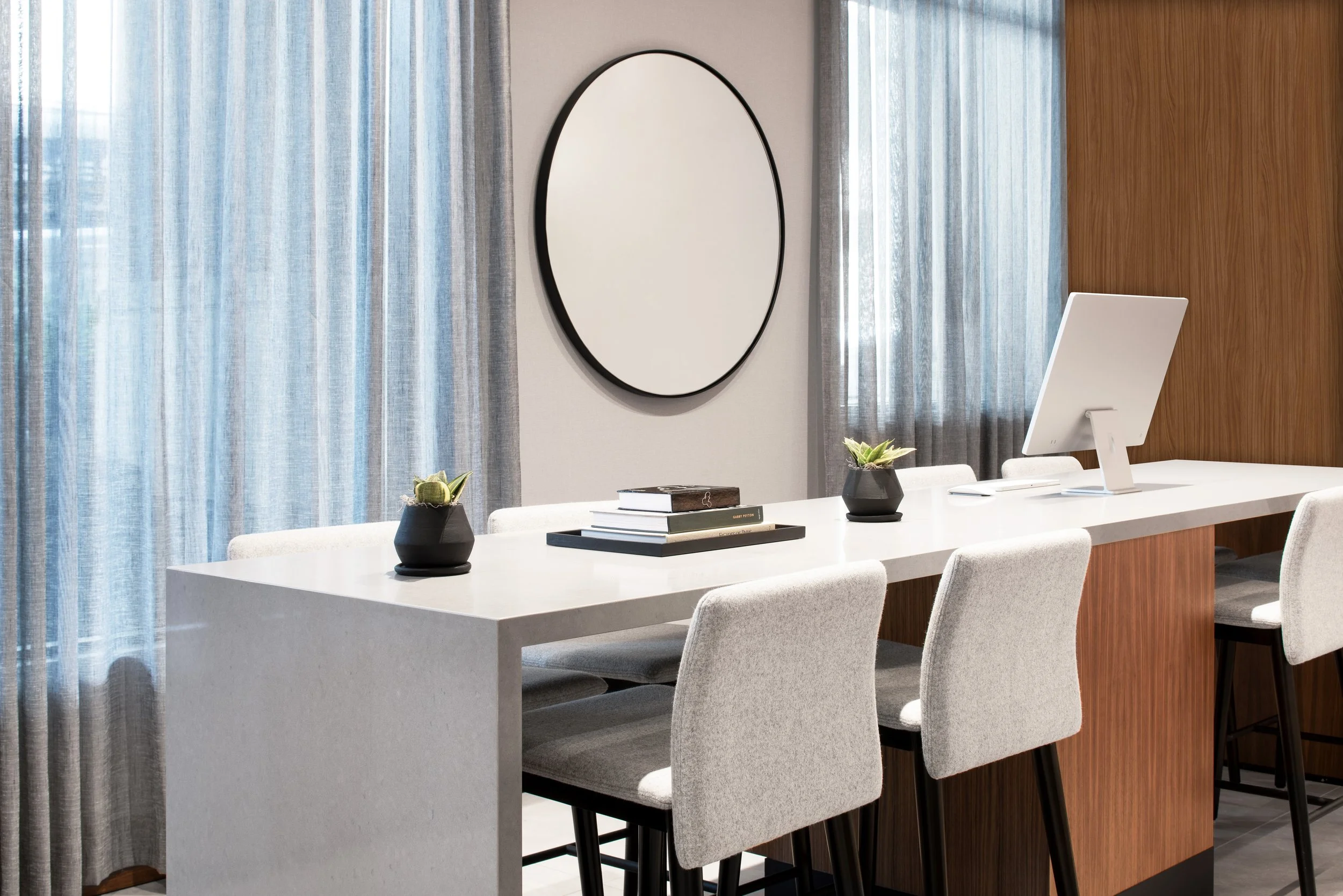 Quartz and wood computer station with fabric stools