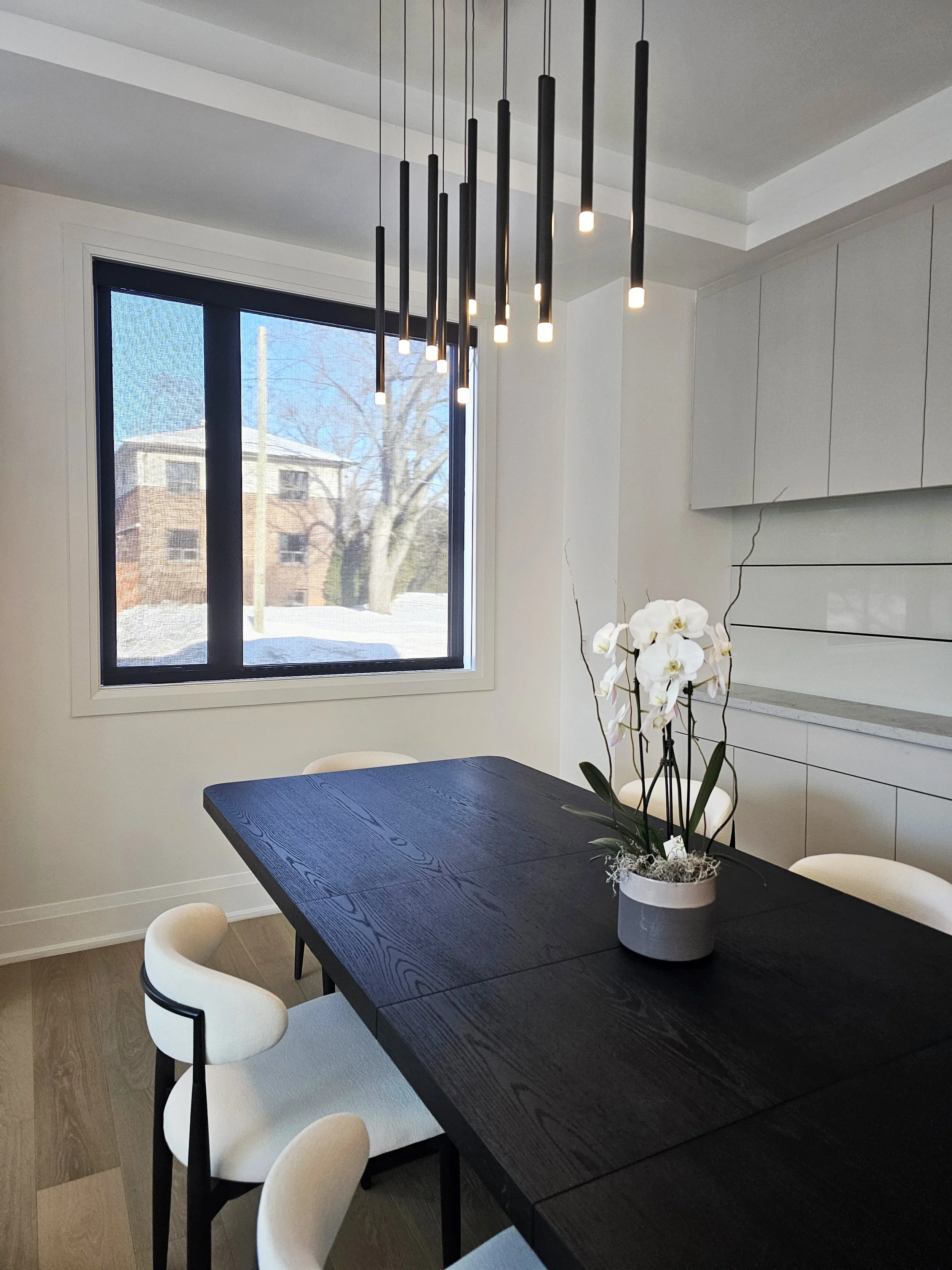 Modern dining room with linear chandelier