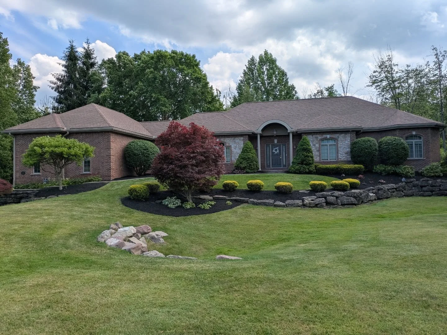 One of our larger landscaping projects this summer on a residential property, included trimming back 30 bushes and cutting back some small trees. And the installation of 9 yards of fresh mulch to the surrounding landscape. 

Check out our website or 
