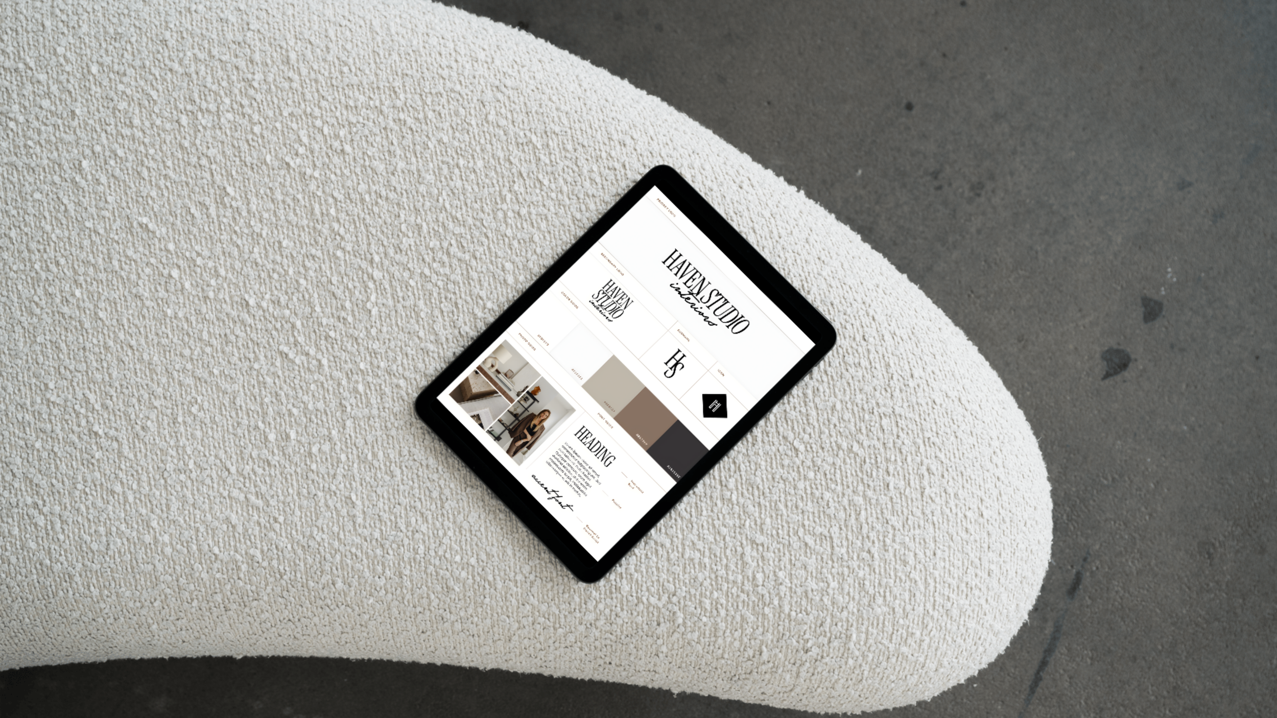 Smartphone displaying a website on a textured surface with a concrete floor in the background.