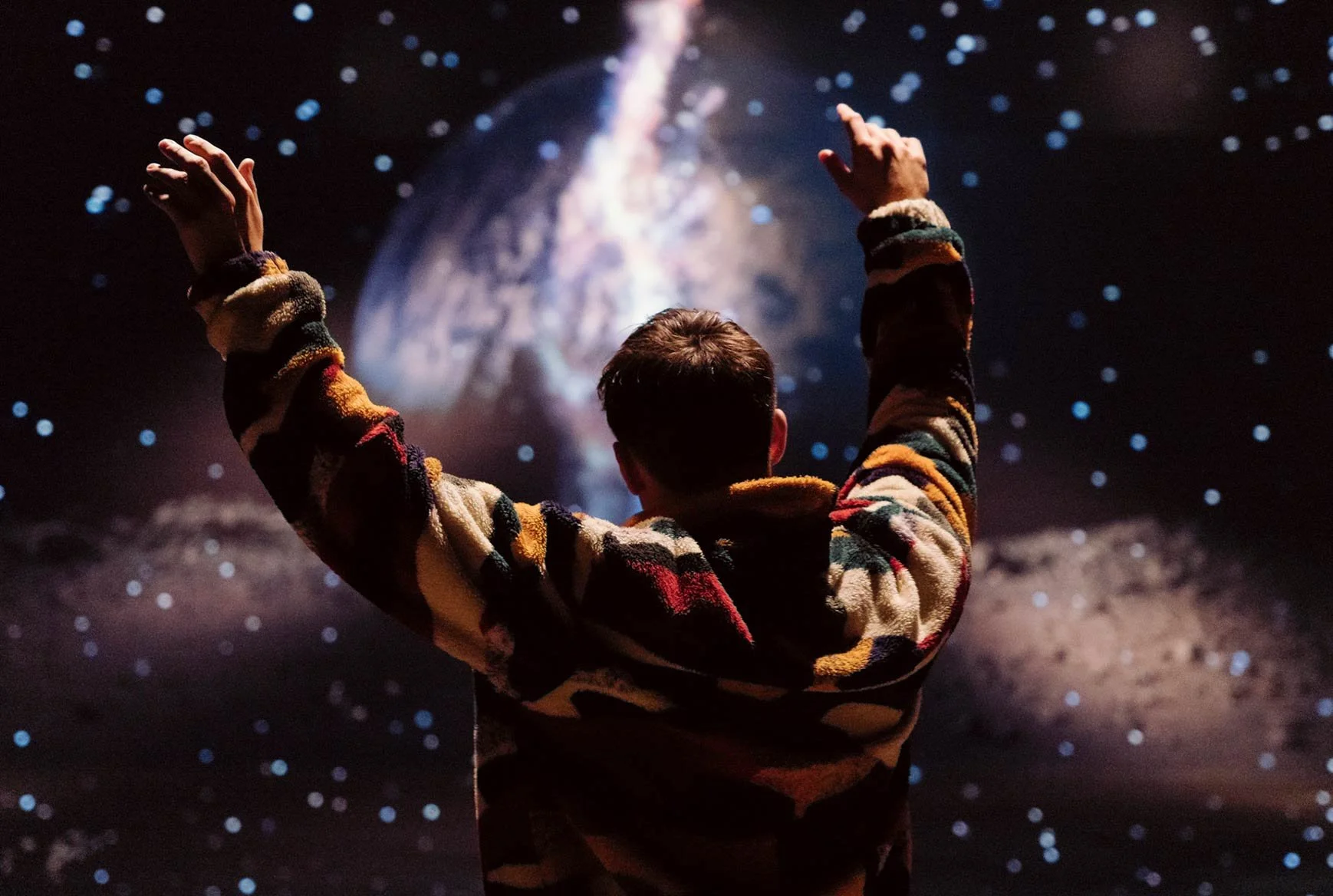 a man interacts with a holographic projection
