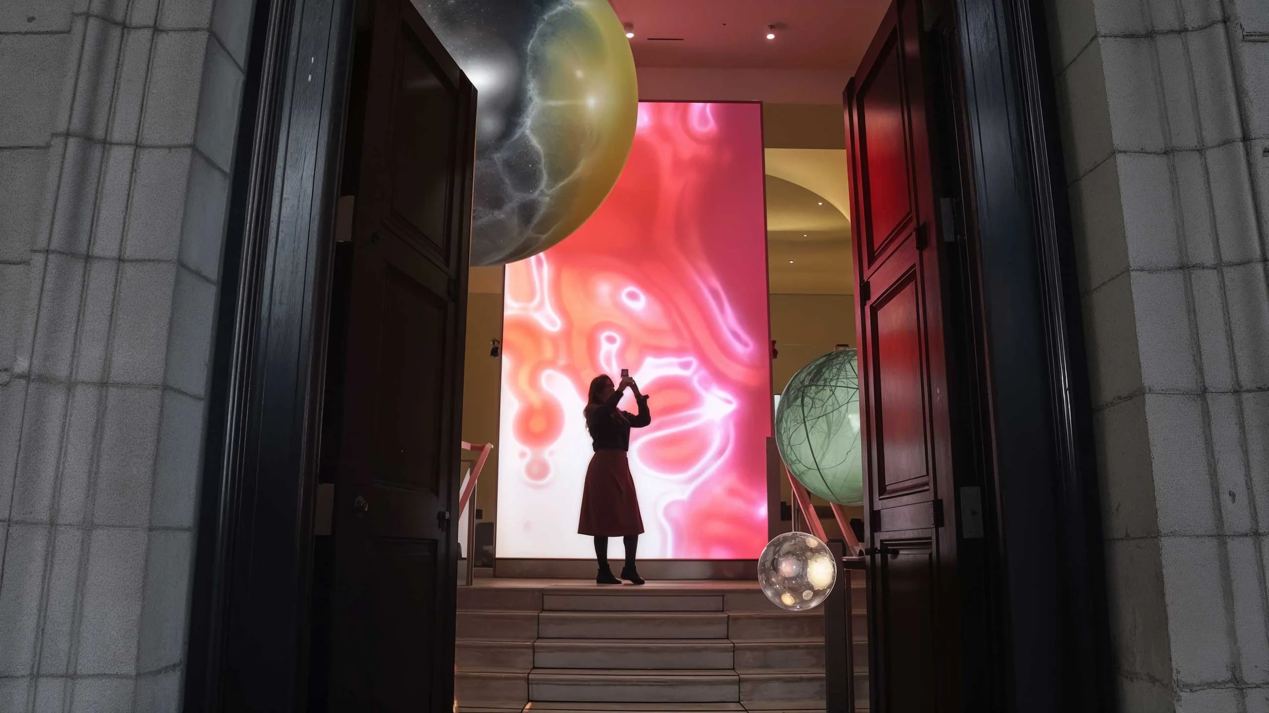 a women interacts with an immersive installation featuring a film by bright side studios