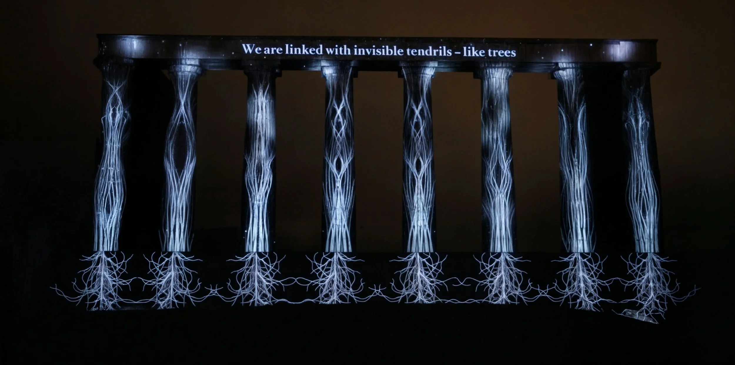 Large-scale architectural projection mapping on the National Monument of Scotland, Calton Hill, Edinburgh, during Edinburgh's Hogmanay New Year celebrations, created by Bright Side Studios