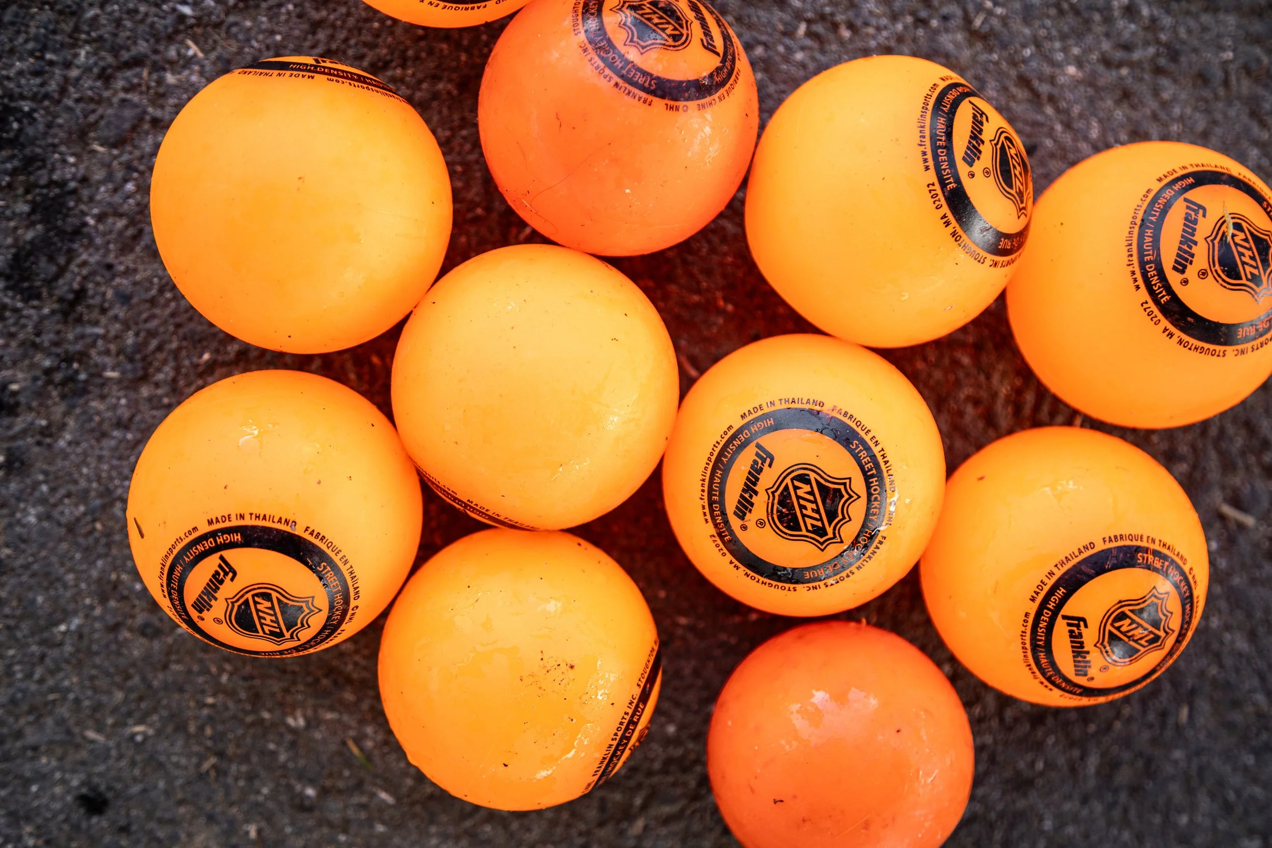 McVander Hockey plays with an orange hockey ball.