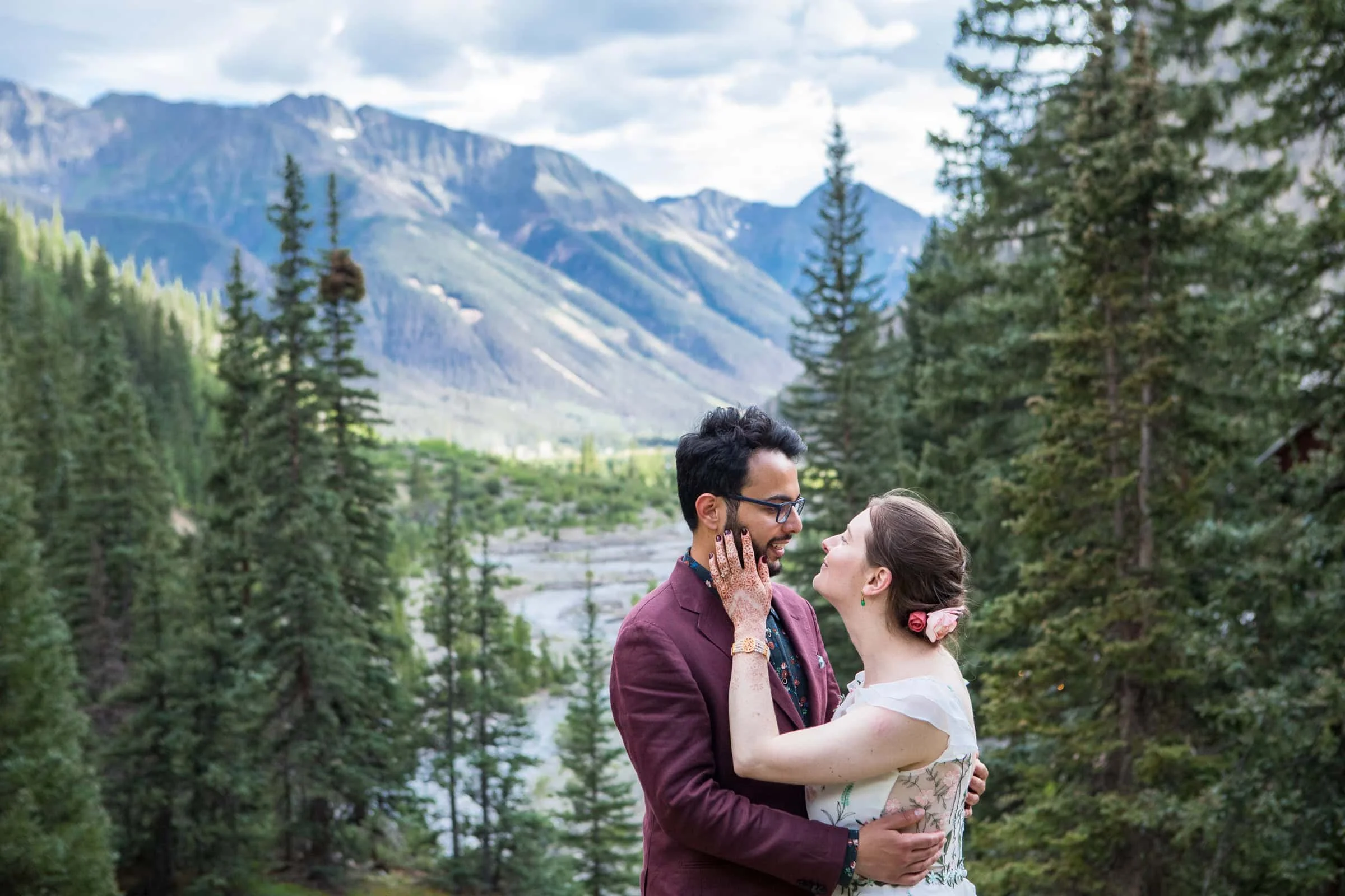 A couple embraces in the San Juan Mountains during their elopement.