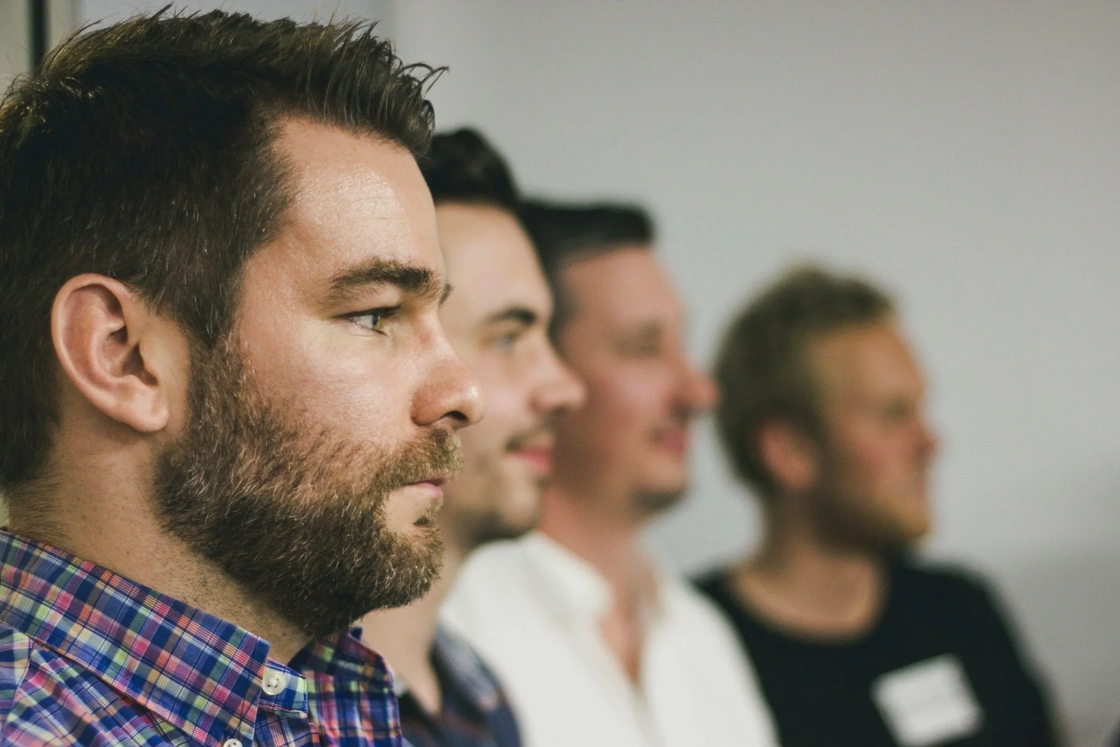 Group therapy session with adults focused on discussion, reflection, and personal growth