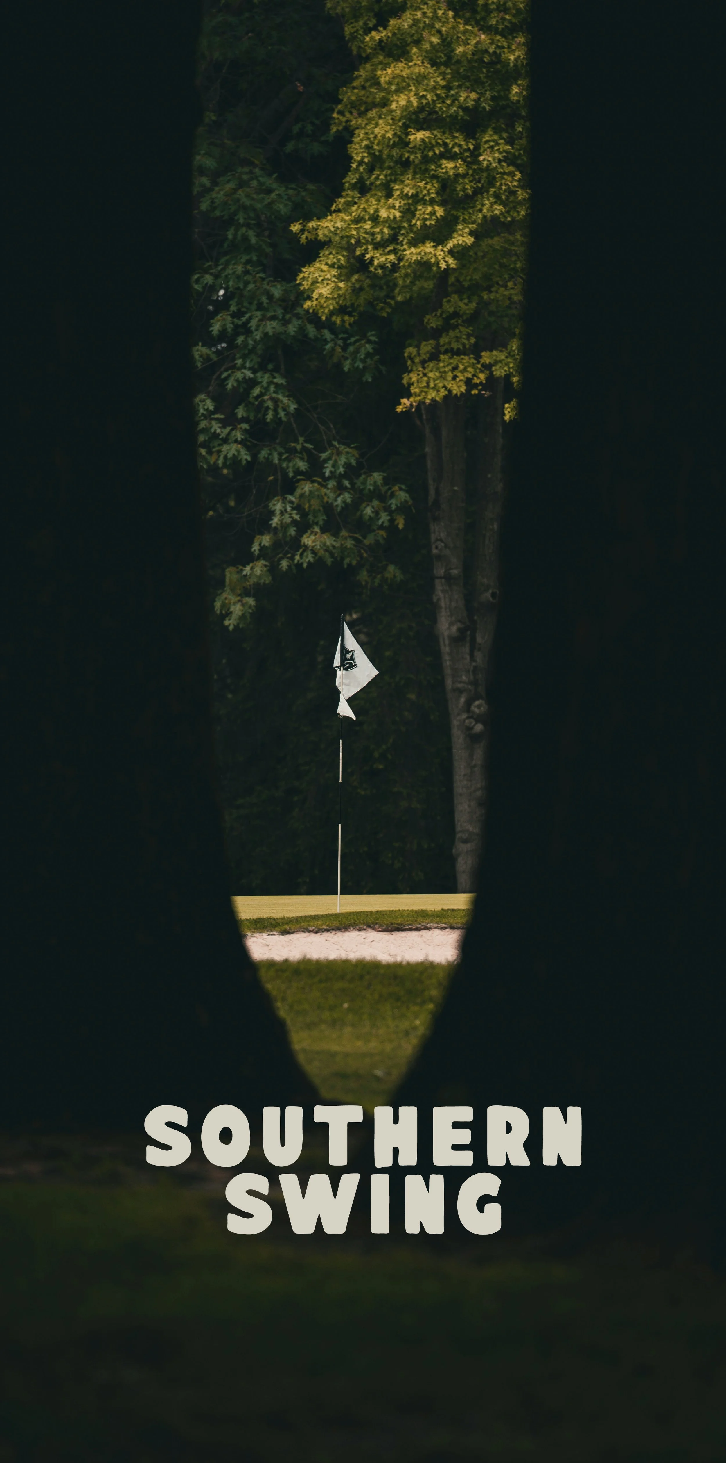 Golf course view through a narrow opening with trees, showing a golf flag on the green and the text 'SOUTHERN SWING' at the bottom.