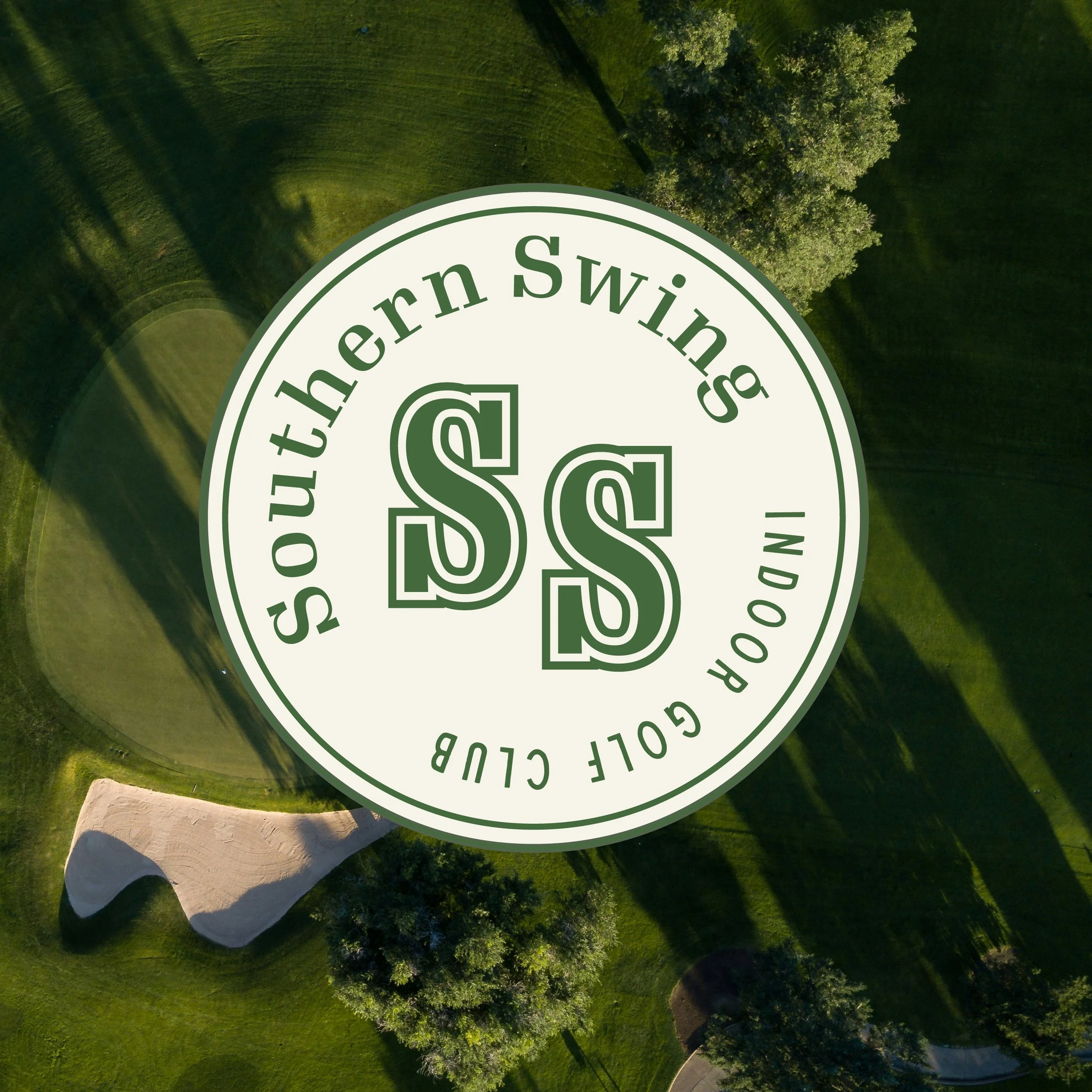 Aerial view of a golf course with trees, a sand trap, and a green, overlaid with a circular logo that reads 'Southern Swing Golf Club' and features an intertwined 'S S' in the center.