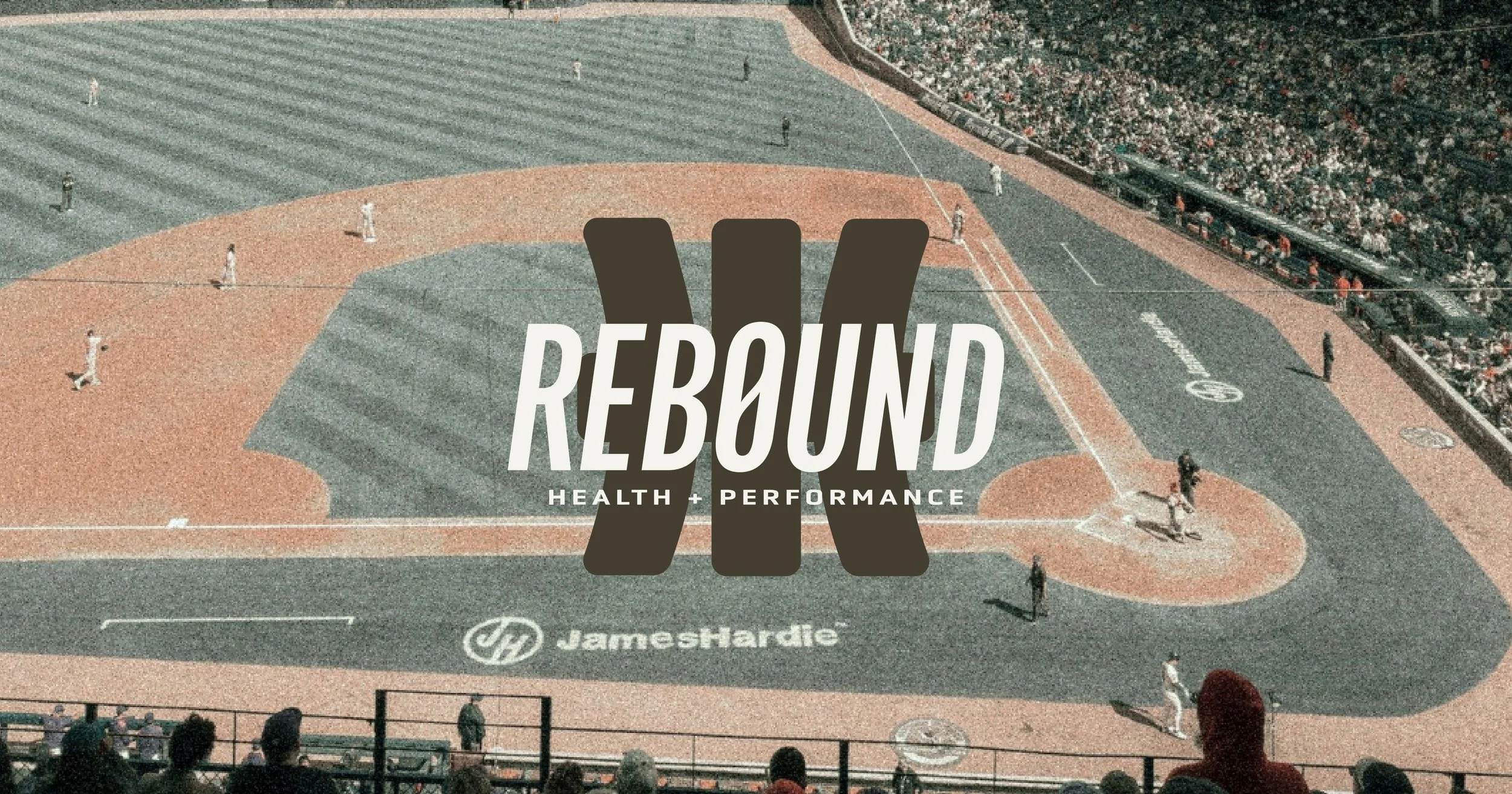 rebound health and performance logo on top of baseball field background