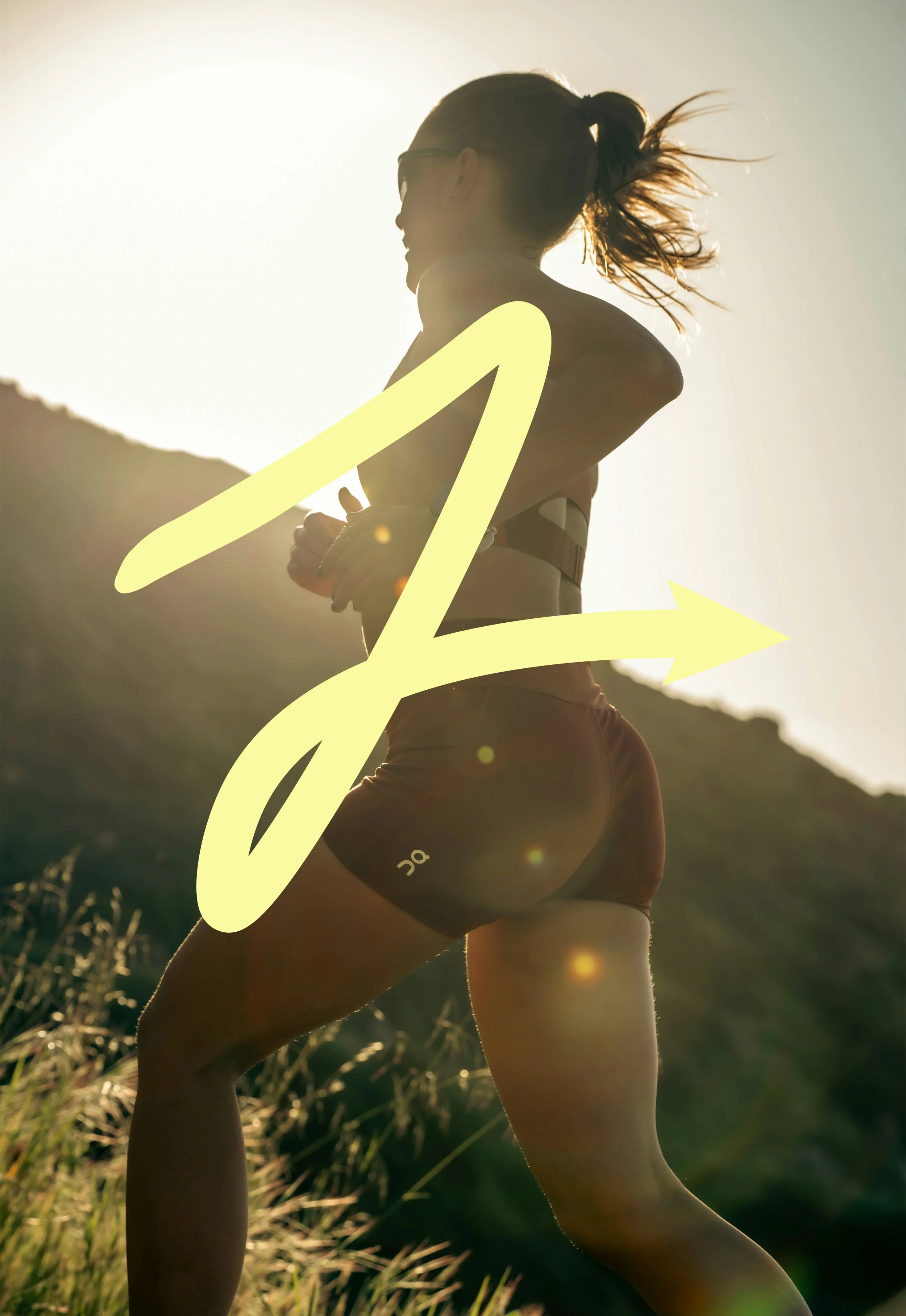 zenith pro yellow icon on top of a woman trail running