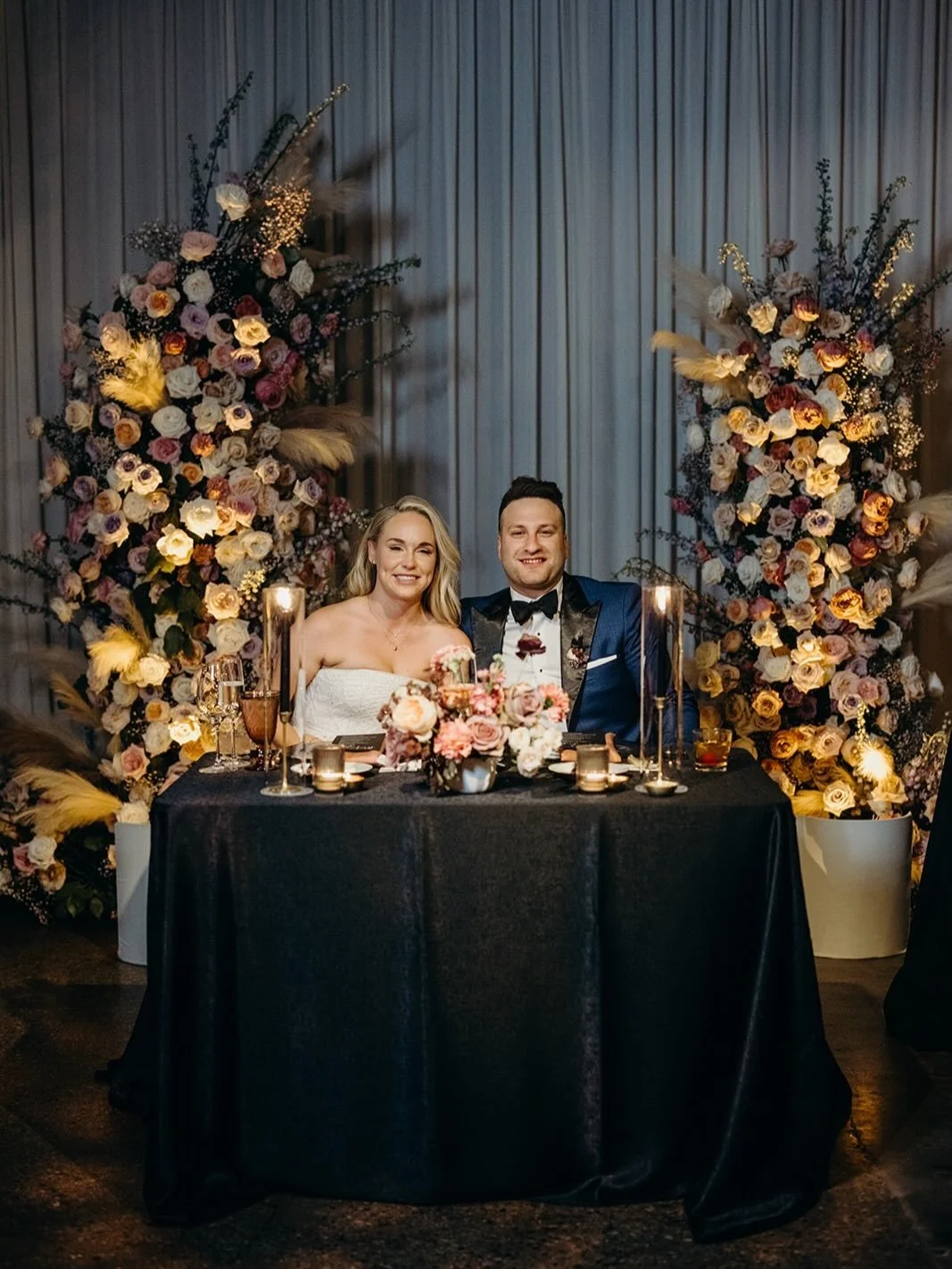 Intimacy is something you build into a room.

It shows up in the lighting, in the spacing between tables, in how close guests are to one another once they sit down. Here, the darker palette and candlelight kept the focus low and close, while the over