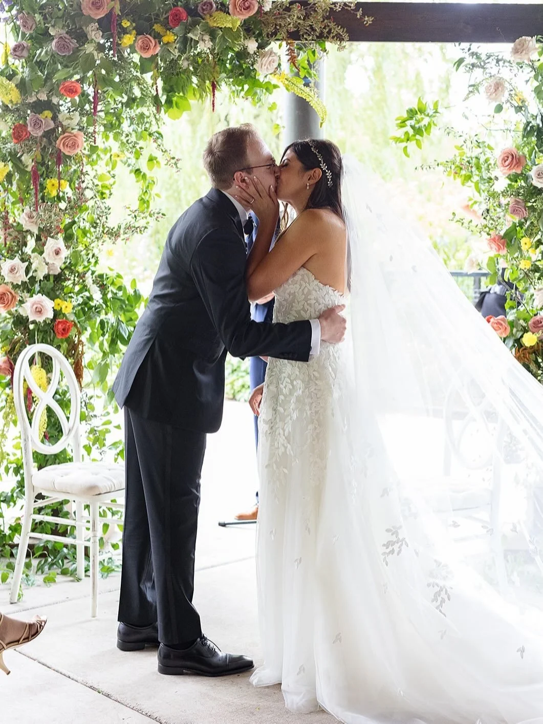 Color set tone of this day and was carried through every detail.

You see it begin at the ceremony, then follow it into the reception where it deepens as the light shifts. The installation overhead changes how the room feels, while the tables bring e