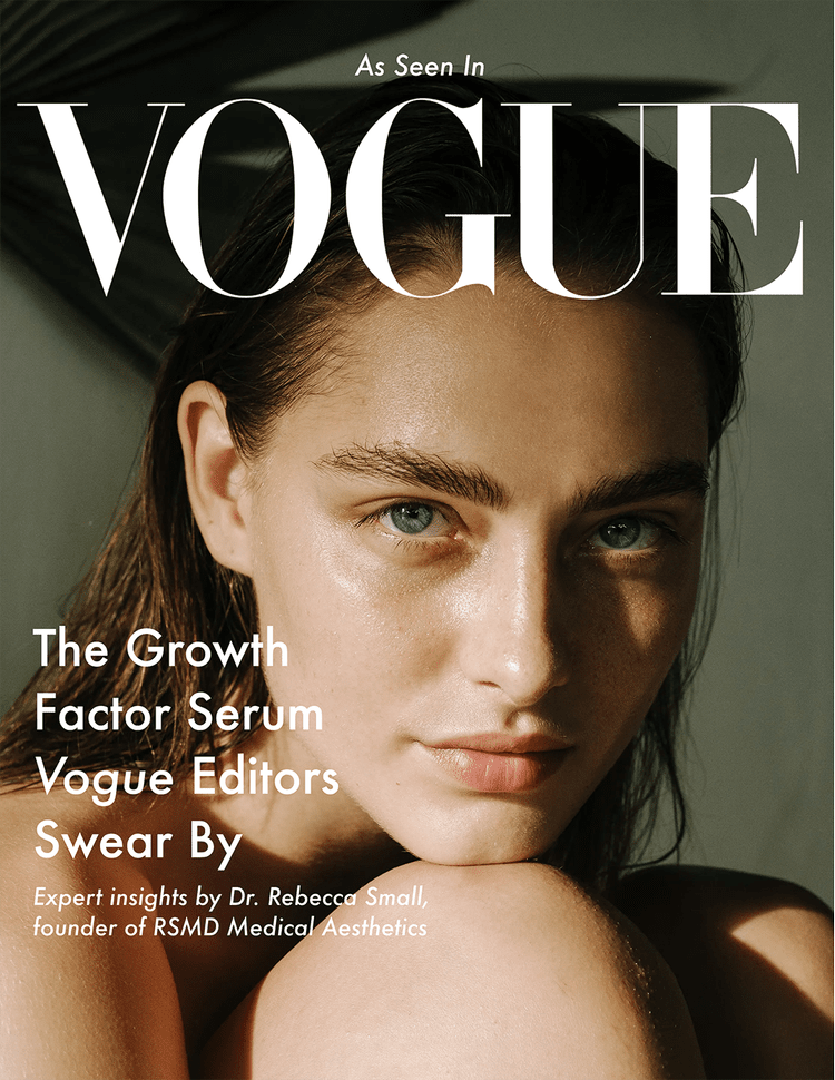 Close-up of a young woman with blue eyes and wet hair on the cover of Vogue magazine, featuring headlines about skincare and expert insights.