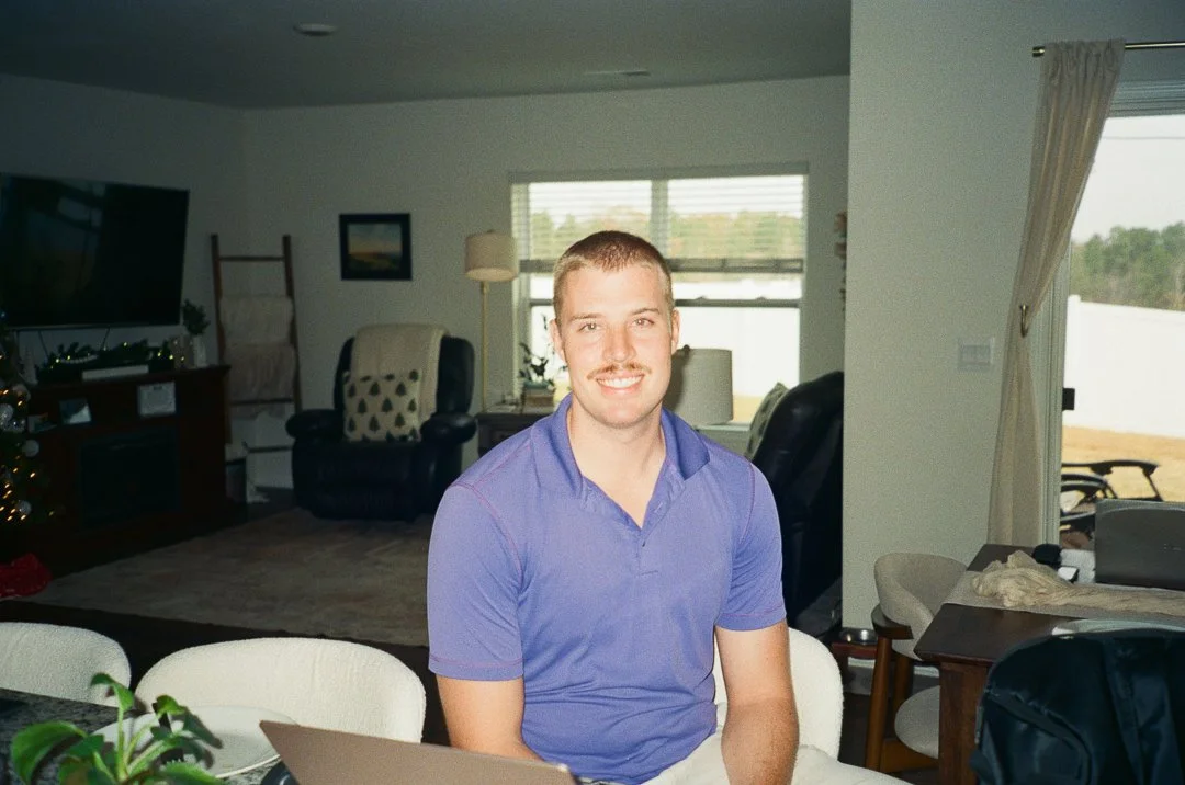 caleb estell headshot in home