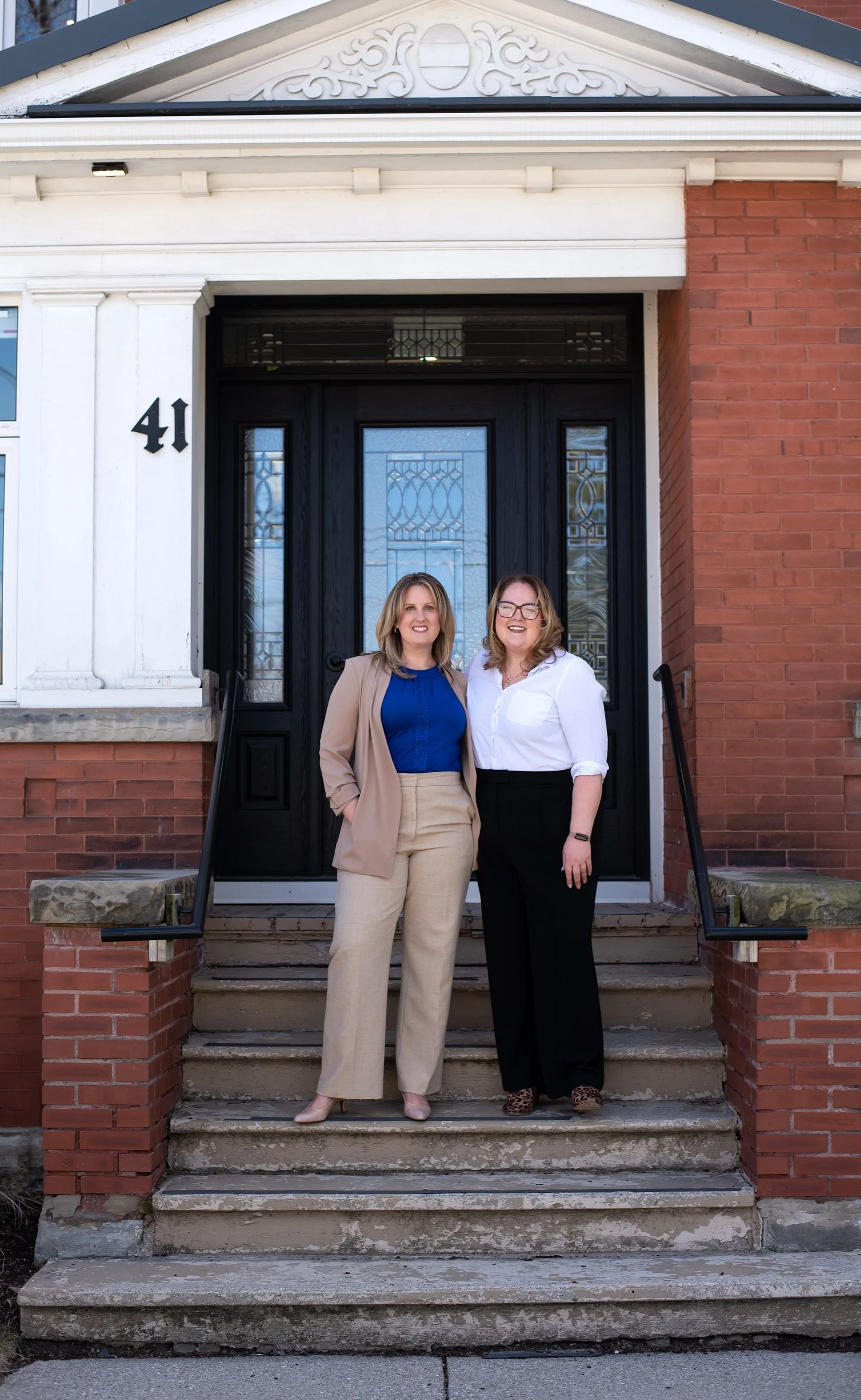 Raechel Pefanis and Susanna Muntz stand in front of Red Maple office in Waterloo, Ontario