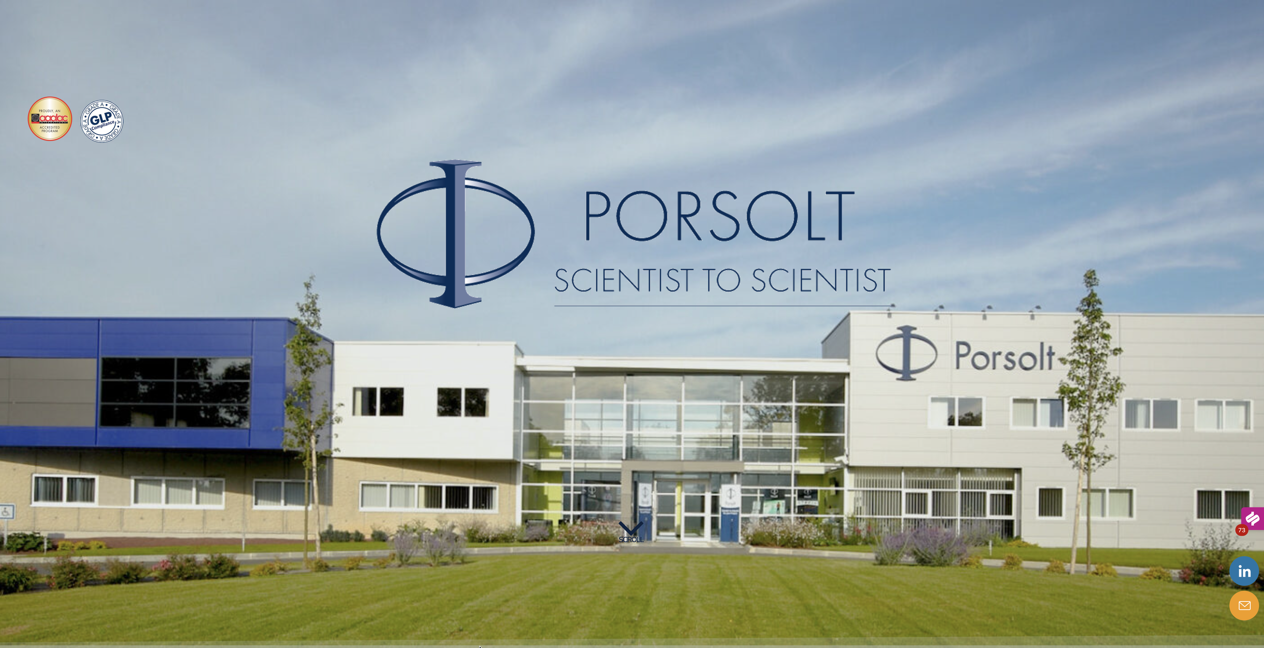 Exterior of the Porsolt building with a large sign displaying the company logo and the slogan "Scientist to Scientist." The building features modern architecture with blue and white panels, large windows, and landscaped greenery, under a partly cloudy sky.