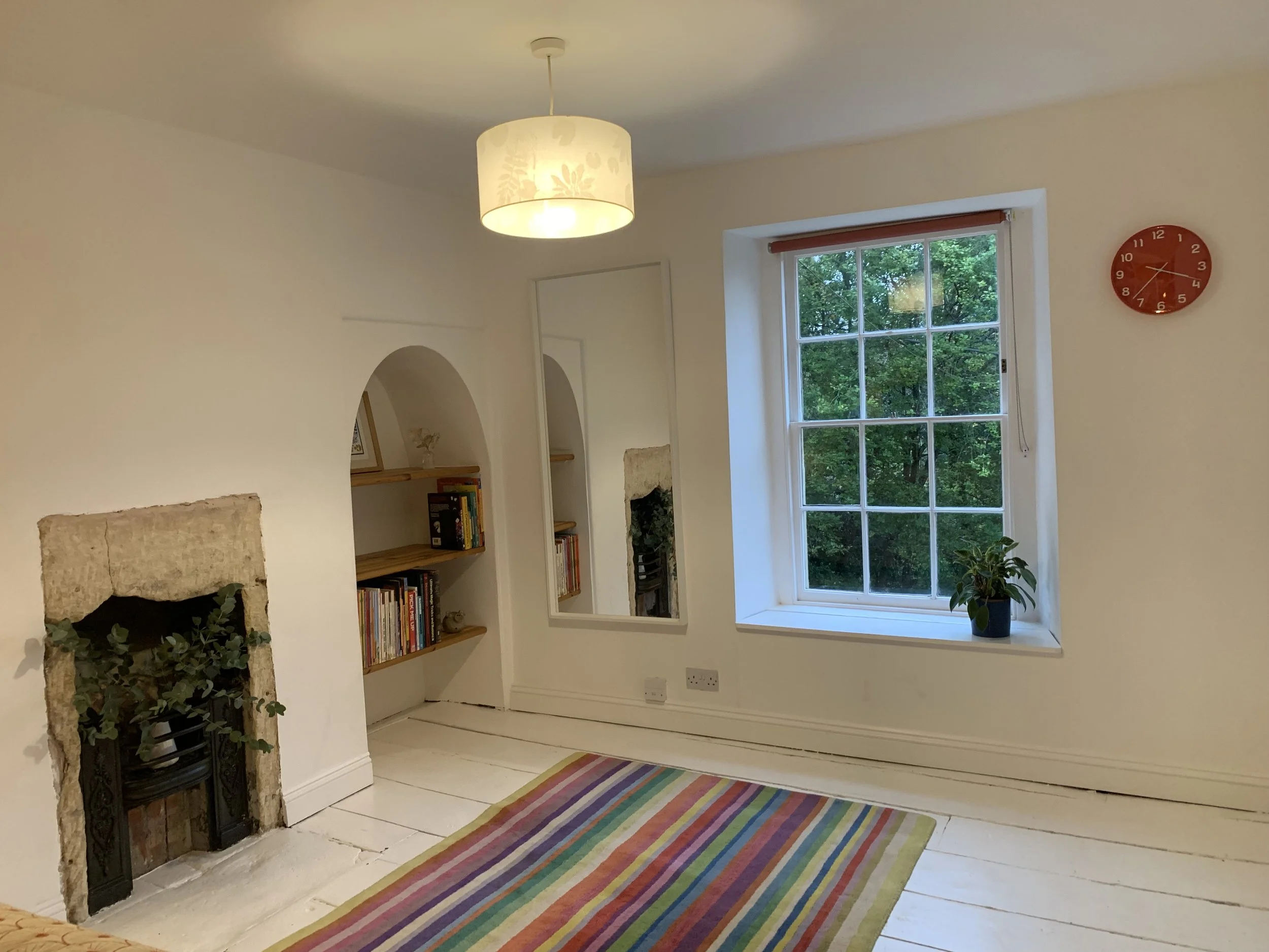Bedroom 2 on first floor - has two lovely alcoves and a little iron fireplace, plus a large, built in wardrobe/cupboard