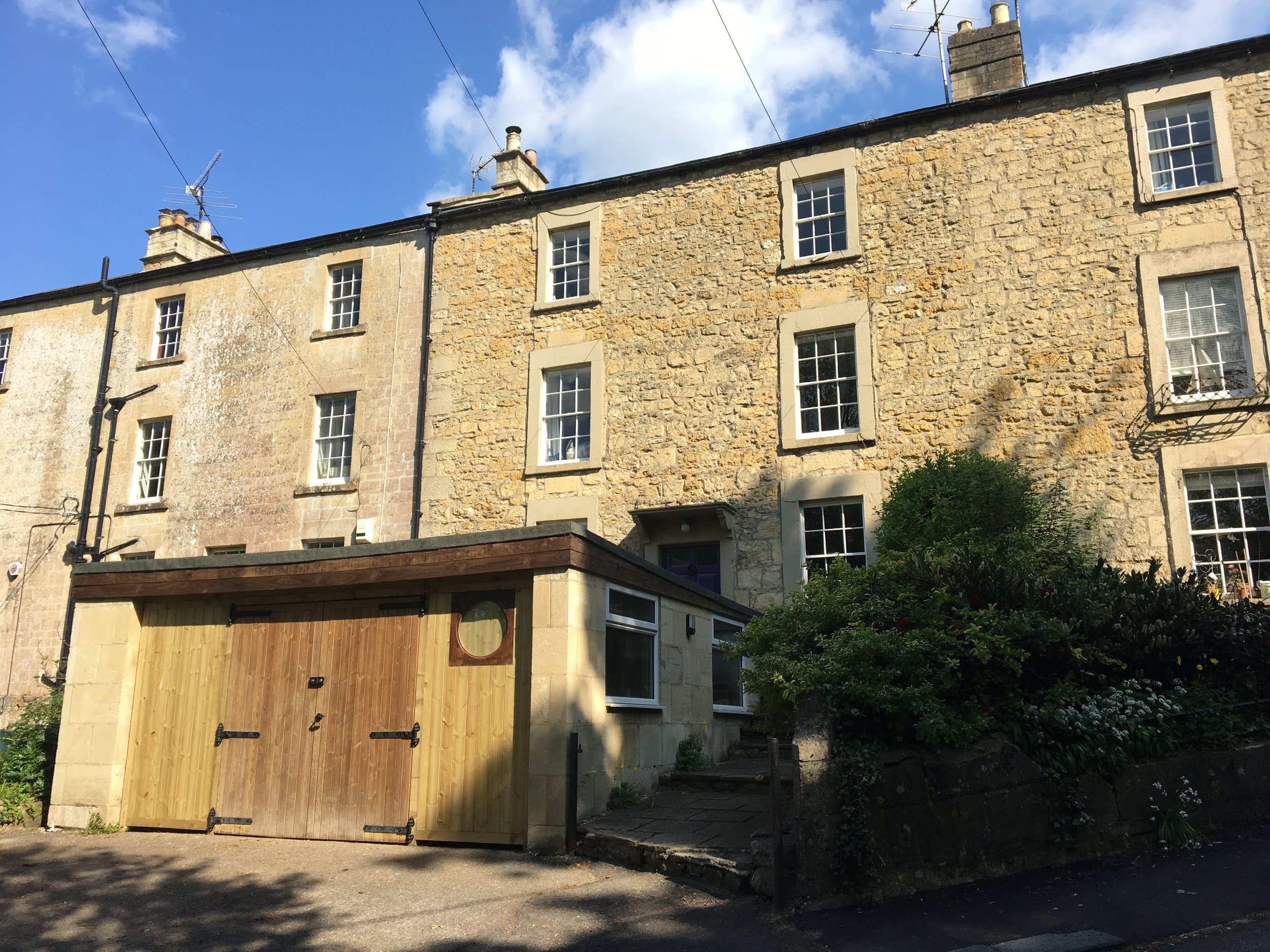 Front of house and huge double garage (fully insulated, with electricity). We used it as a workshop and storage.