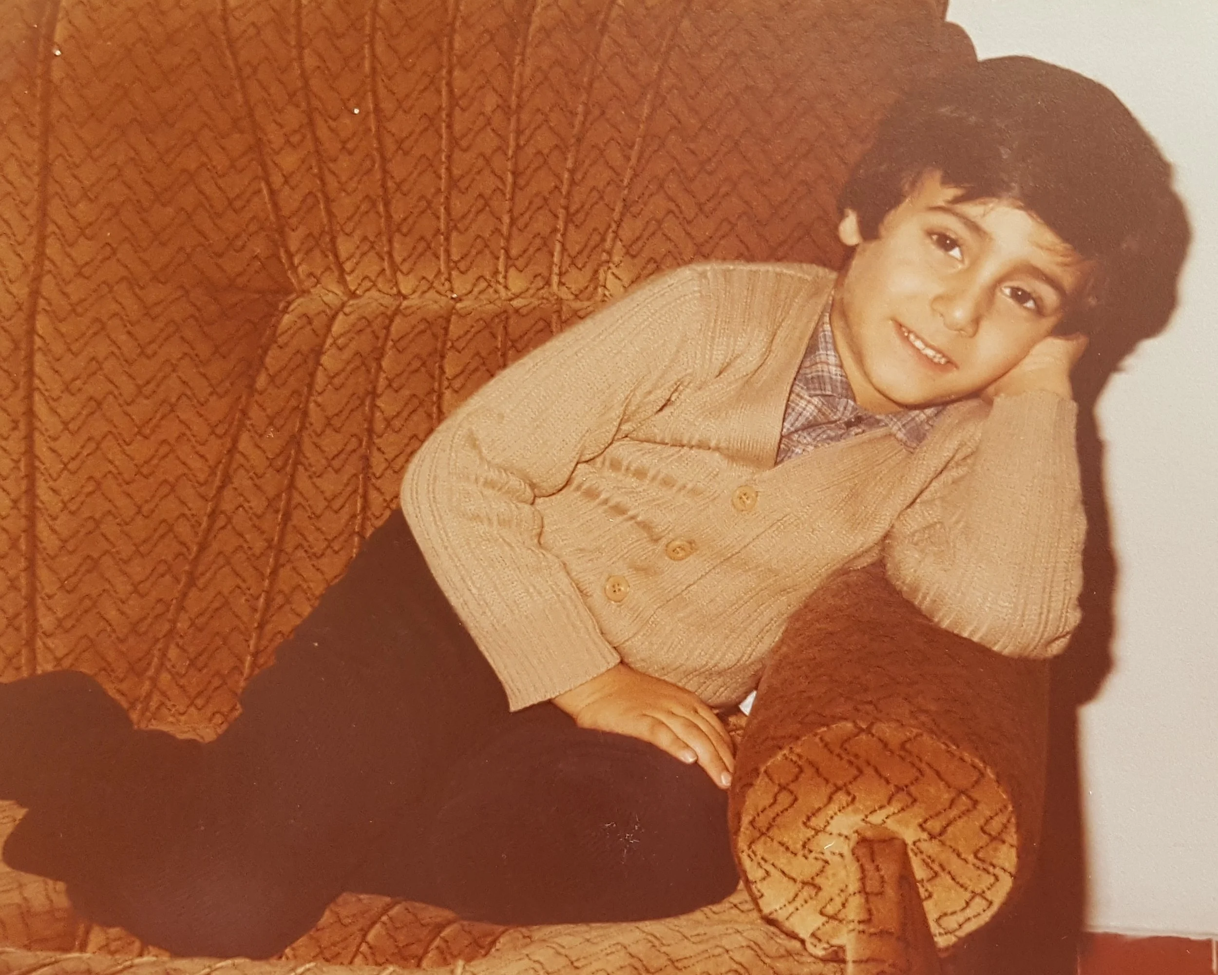 KJ at 7 laying on couch.jpg