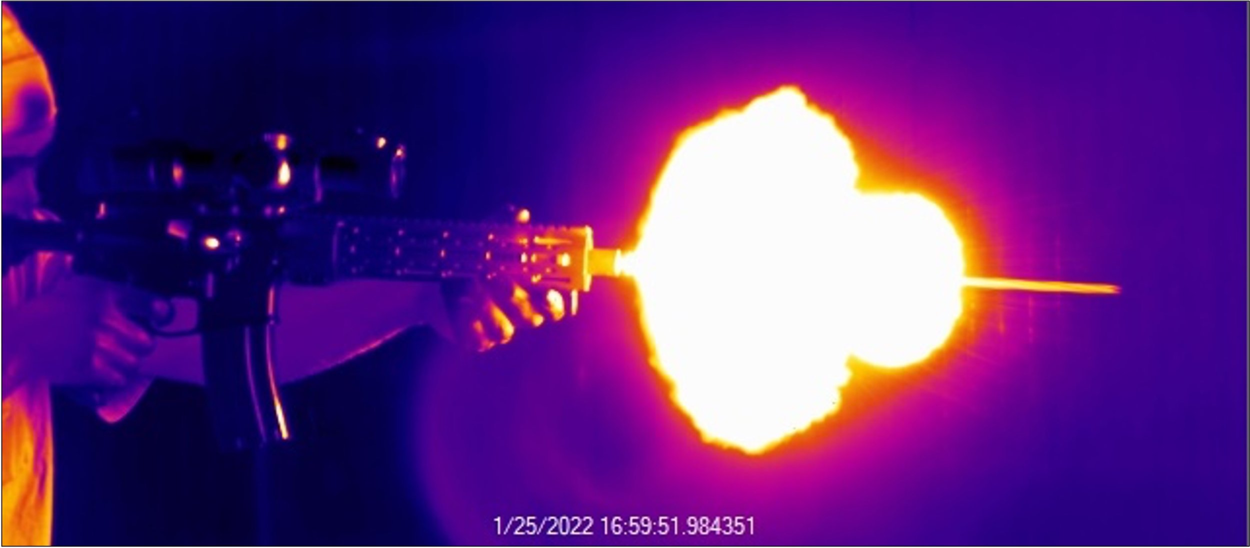 A rifle-style weapon actively being discharged with a visible explosion around the muzzle.