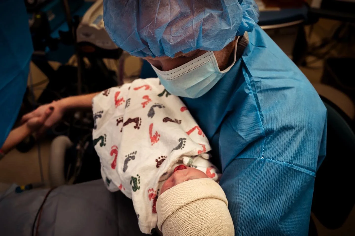 He never let go. When the room started to spin and birth plans shifted, he held on. When the fear set in and the what ifs surfaced, he held on. When the drape was set and the instruments aligned, he held on. When she sobbed as she brought her baby in