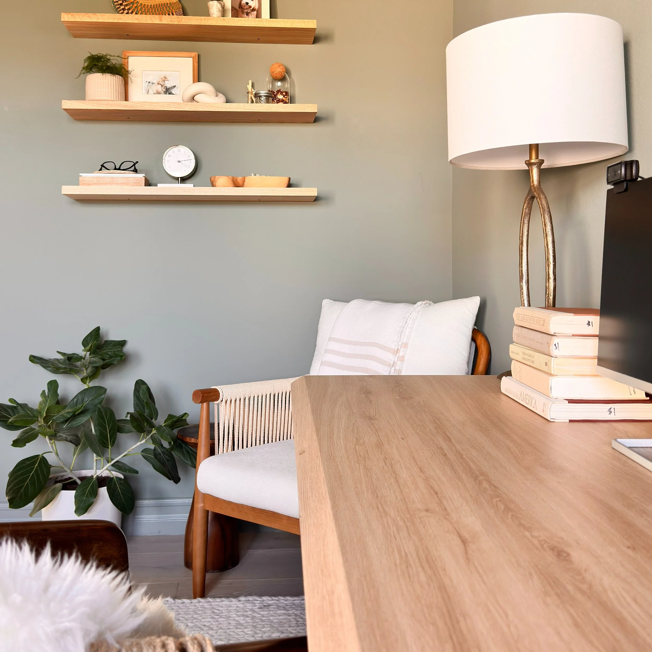 Sometimes it&rsquo;s the smallest details that make a room feel complete.

In this home office, floating shelves created the perfect place to add warmth, texture and personality without taking up valuable floor space. A thoughtful mix of books, art a