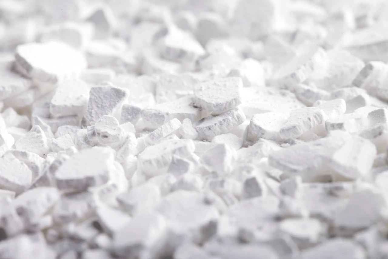 Close-up of white, rough-textured calcium carbonate chunks
