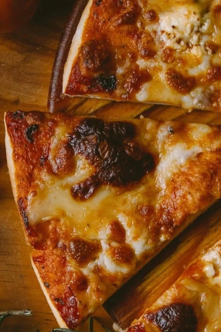 A classic Margherita pizza with fresh basil, tomato sauce, and melted mozzarella at Desotos Eatery.