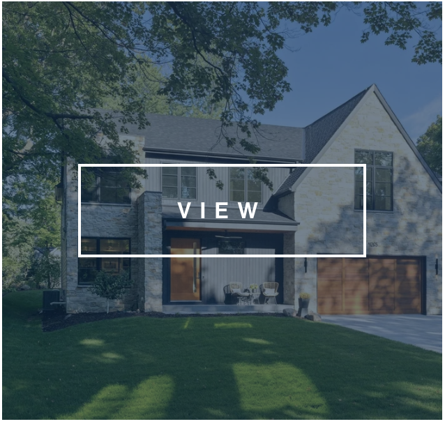 modern home facade with front porch, stone detail, and 2 car wood garage doors