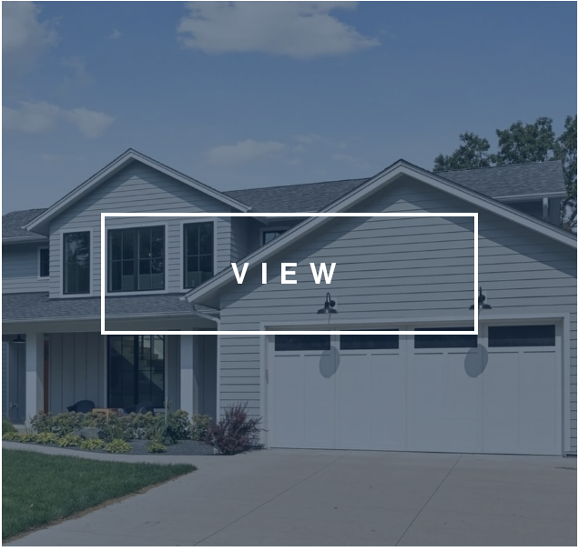 Grey two-story home facade with 2 car garage