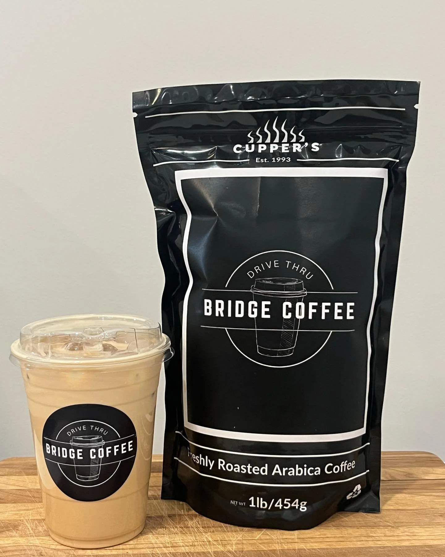 Iced latte and coffee beans packaged