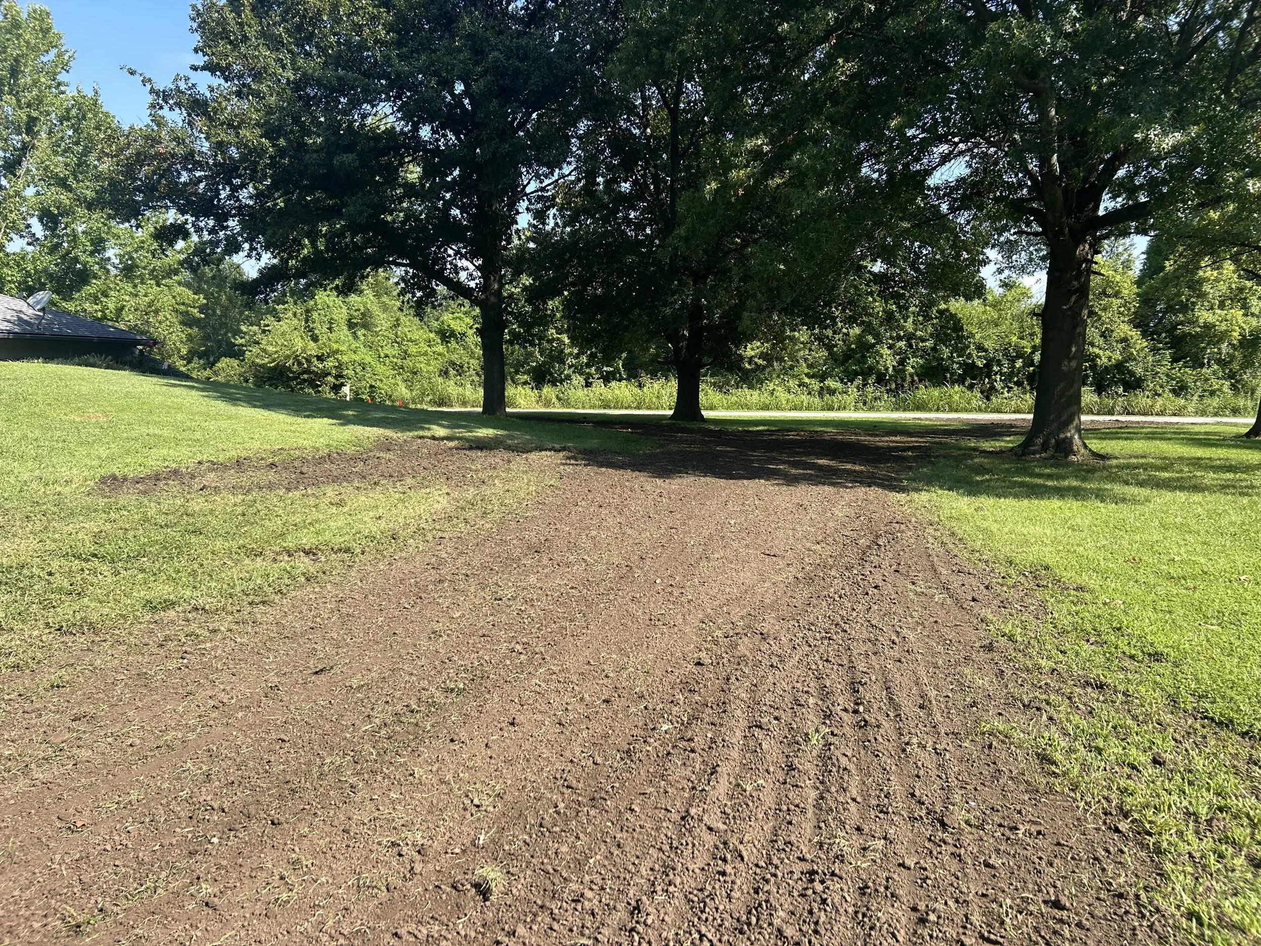 Soil grading to level yard and improve drainage