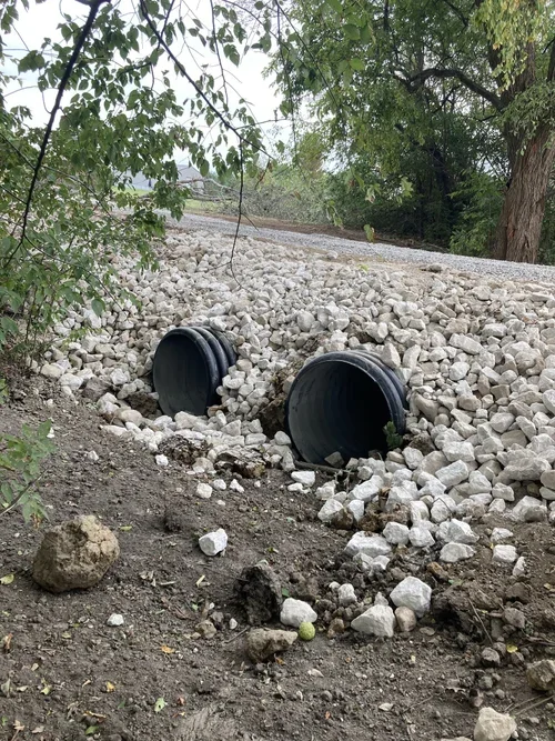 Culvert Installation using pipe and covered with stone