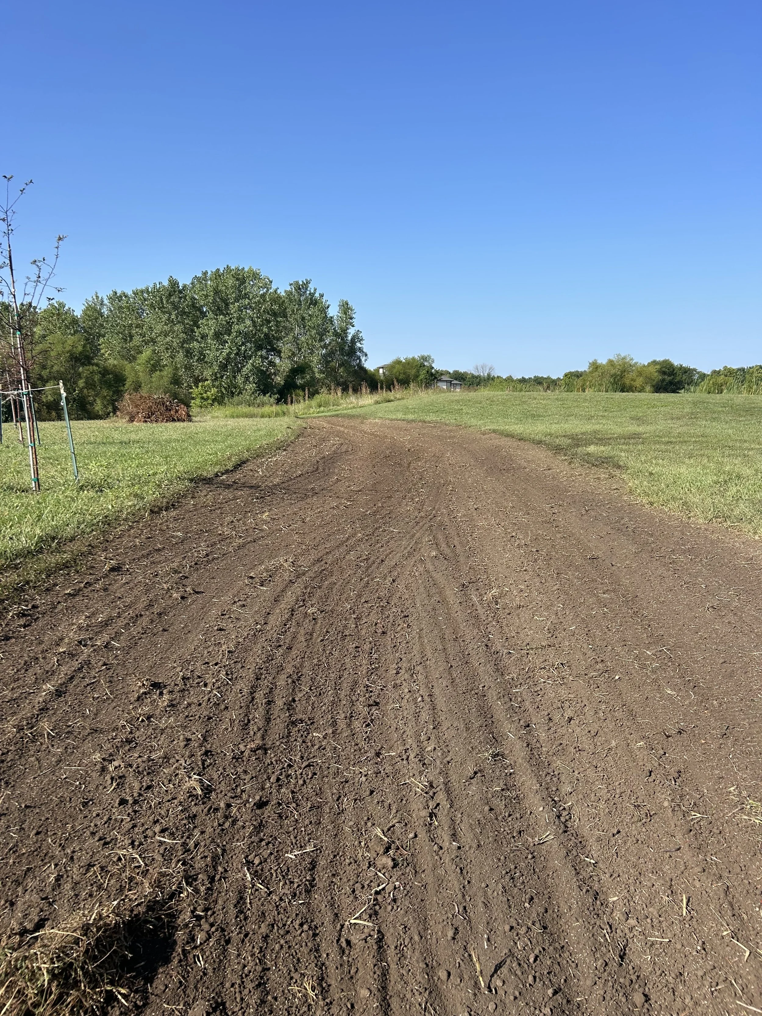 Soil grading to level yard and improve drainage