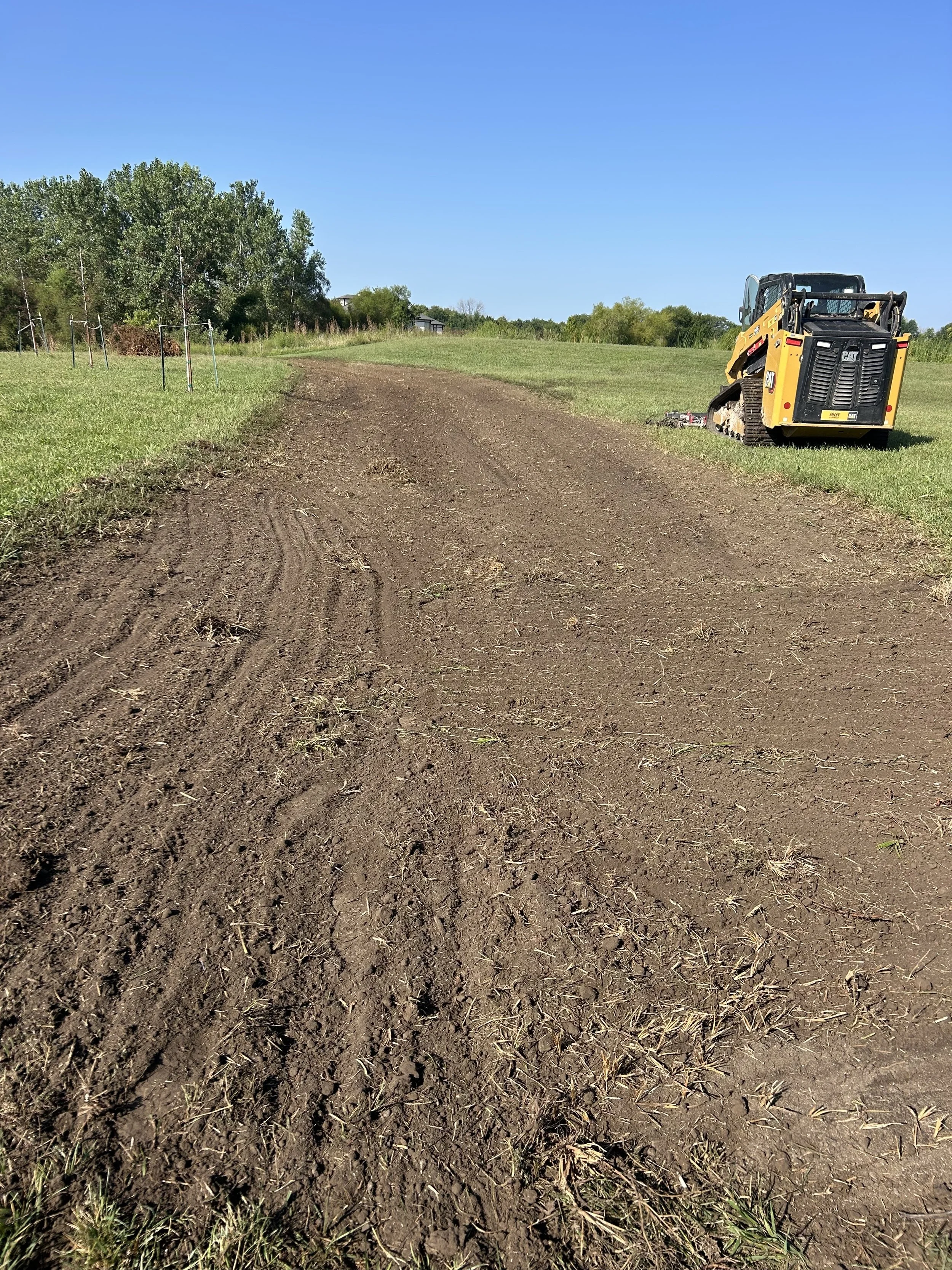 Soil grading to level yard and improve drainage