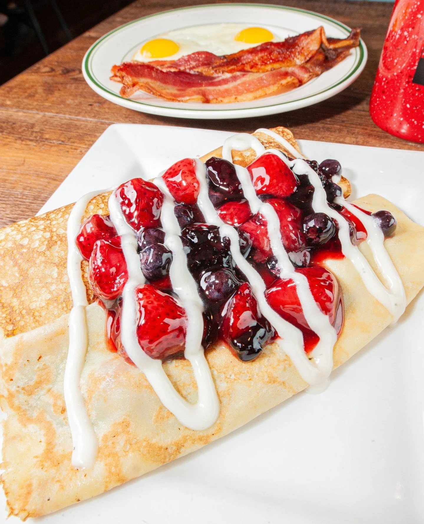 You just a have a little bit longer to try this one before fall is in full swing!🍂⁠
⁠
🍓Berry Crepe Combo: Our house-made crepes filled with your choice of strawberry or triple berry compote topped with drizzled cream cheese icing and powdered sugar