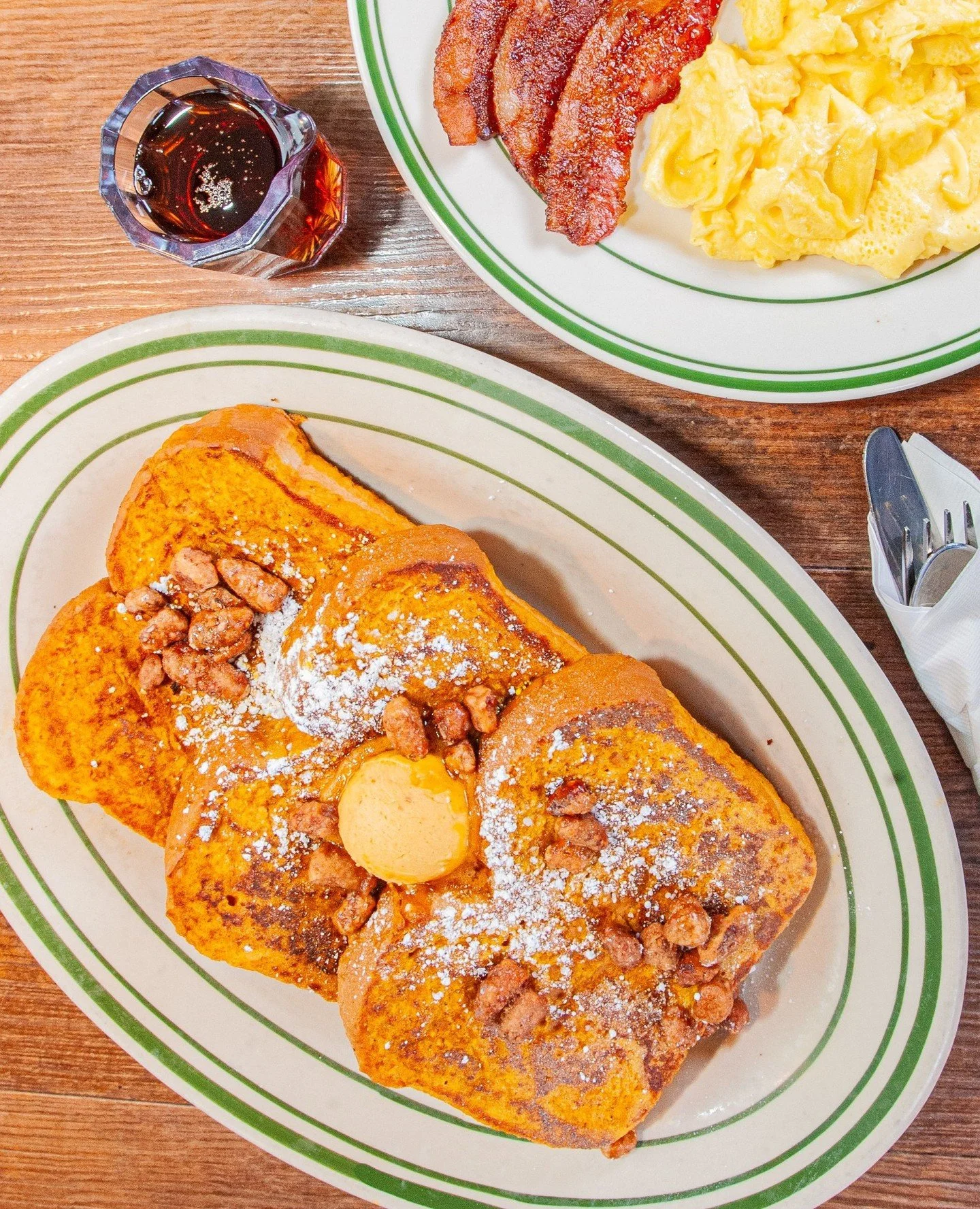 Our Pumpkin French Toast Combo⁠ is pure breakfast decadence! ⁠
⁠
Three thick slices of French bread dipped in our pumpkin batter, topped with glazed pecans and sweet pumpkin butter, then dusted with powdered sugar. Served with two eggs any style and 