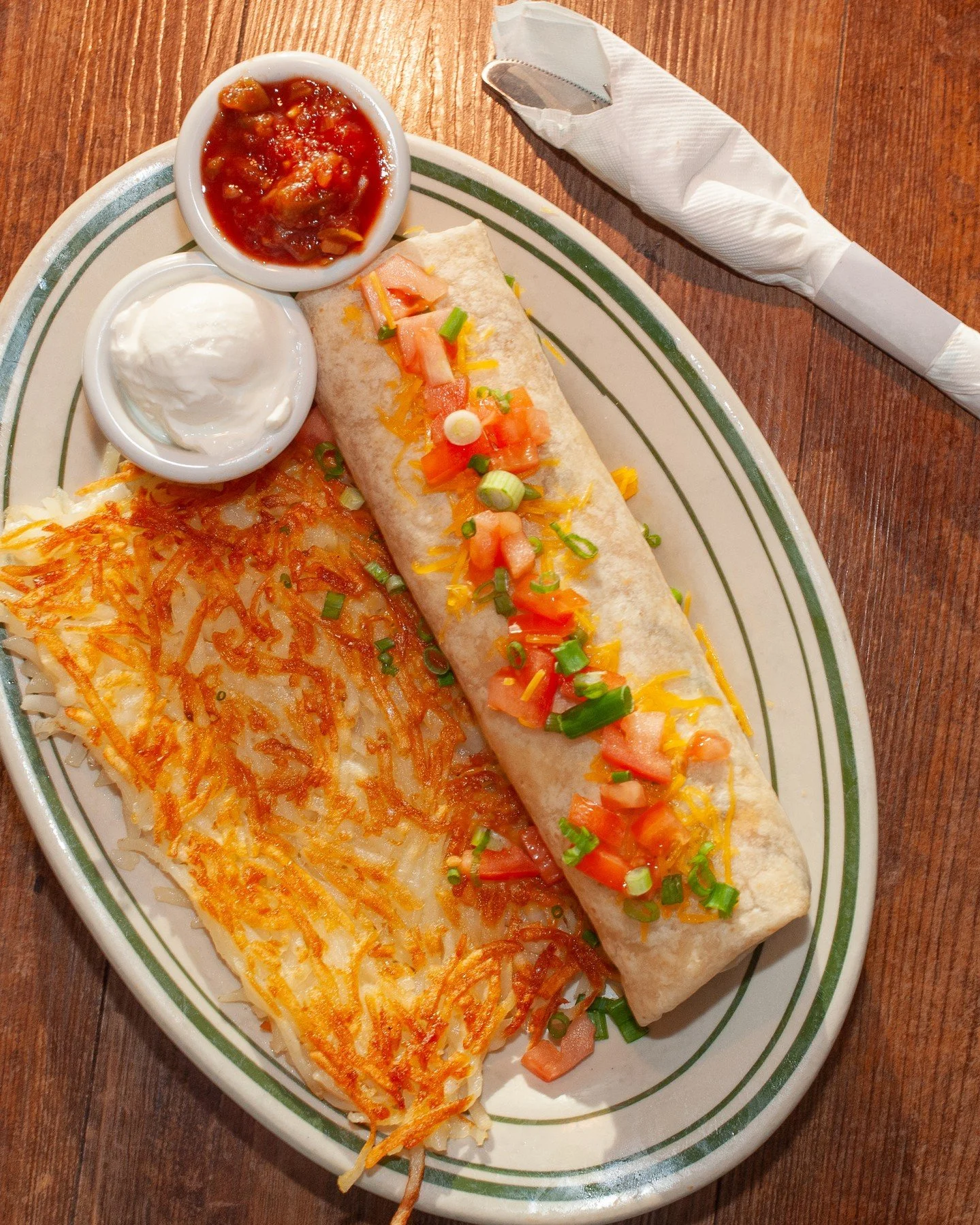 Nothing hits the spot quite like a Southwest Burrito! ⁠
⁠
Diced green peppers, onions, chorizo, house made southwest sauce and scrambled eggs folded into a warm tortilla and topped with cheddar cheese, diced tomatoes and green onions 🌯✨