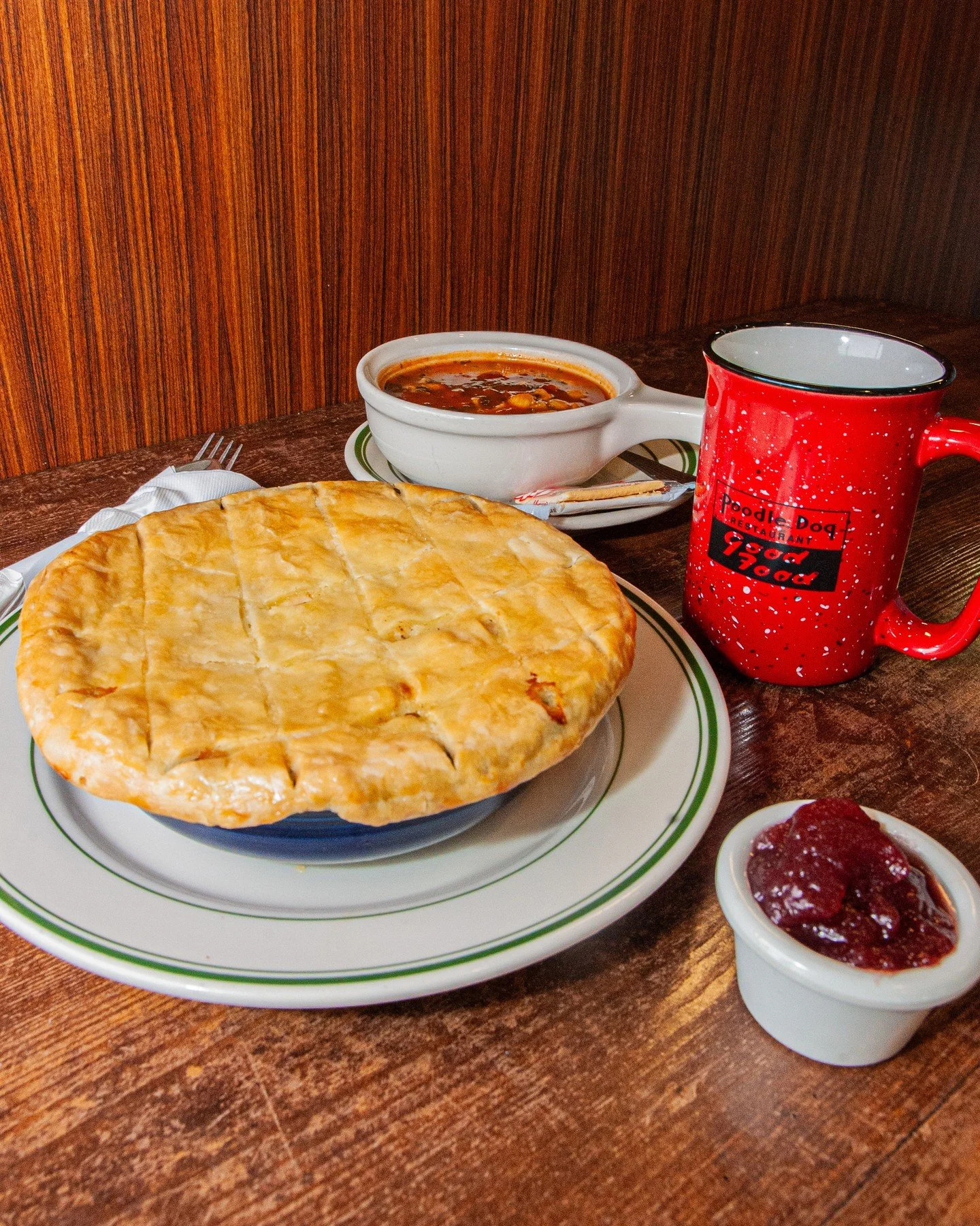 When you&rsquo;re craving something warm and comforting, our Turkey Pot Pie is here for you. It's made from scratch with tender turkey, peas, carrots, and pearl onions in a rich cream sauce, and served with cranberry sauce and your choice of soup or 