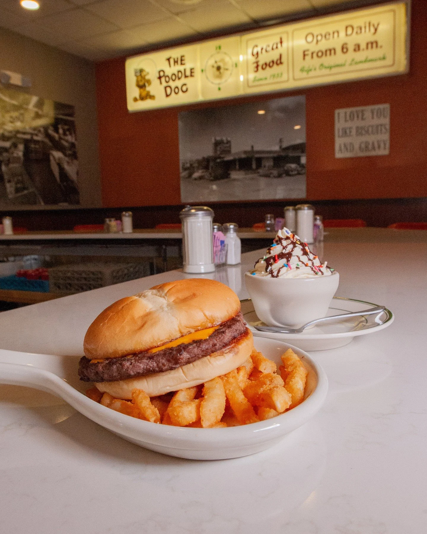 Bring the kiddos in for a classic moment at the counter 🍔🍦⁠
⁠
A juicy burger, a scoop of something sweet, and that old-school magic that never goes out of style ✨️