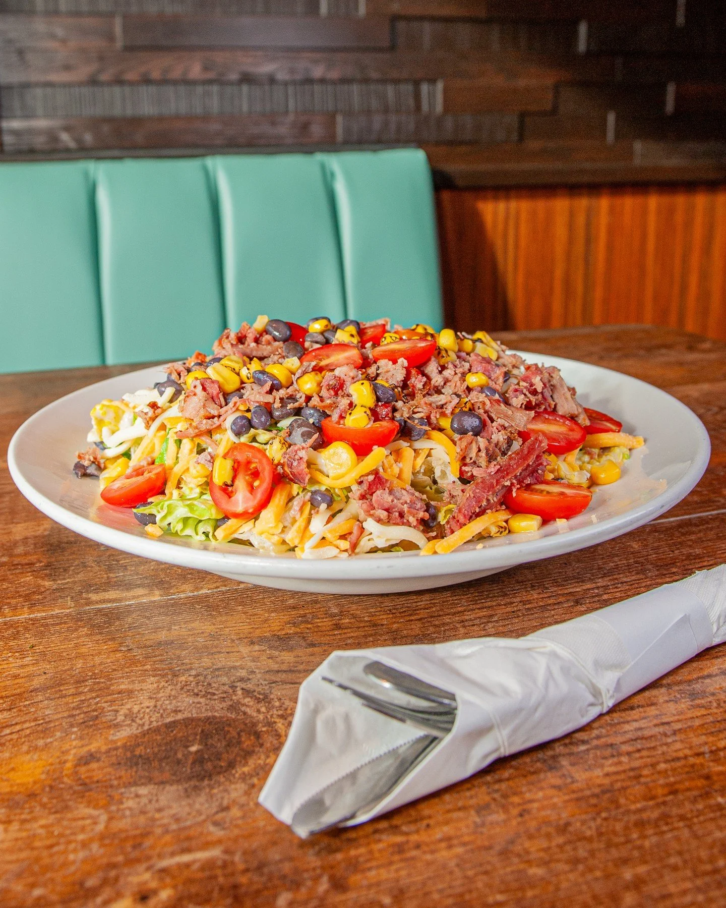 Salad is the perfect match for a bright, sunny day 😎⁠
⁠
Our seasonal Smokehouse Salad is fresh, hearty, and packed with bold flavor. Crisp chopped romaine is tossed with tender beef brisket, juicy grape tomatoes, black beans, sweet corn, and jack ch